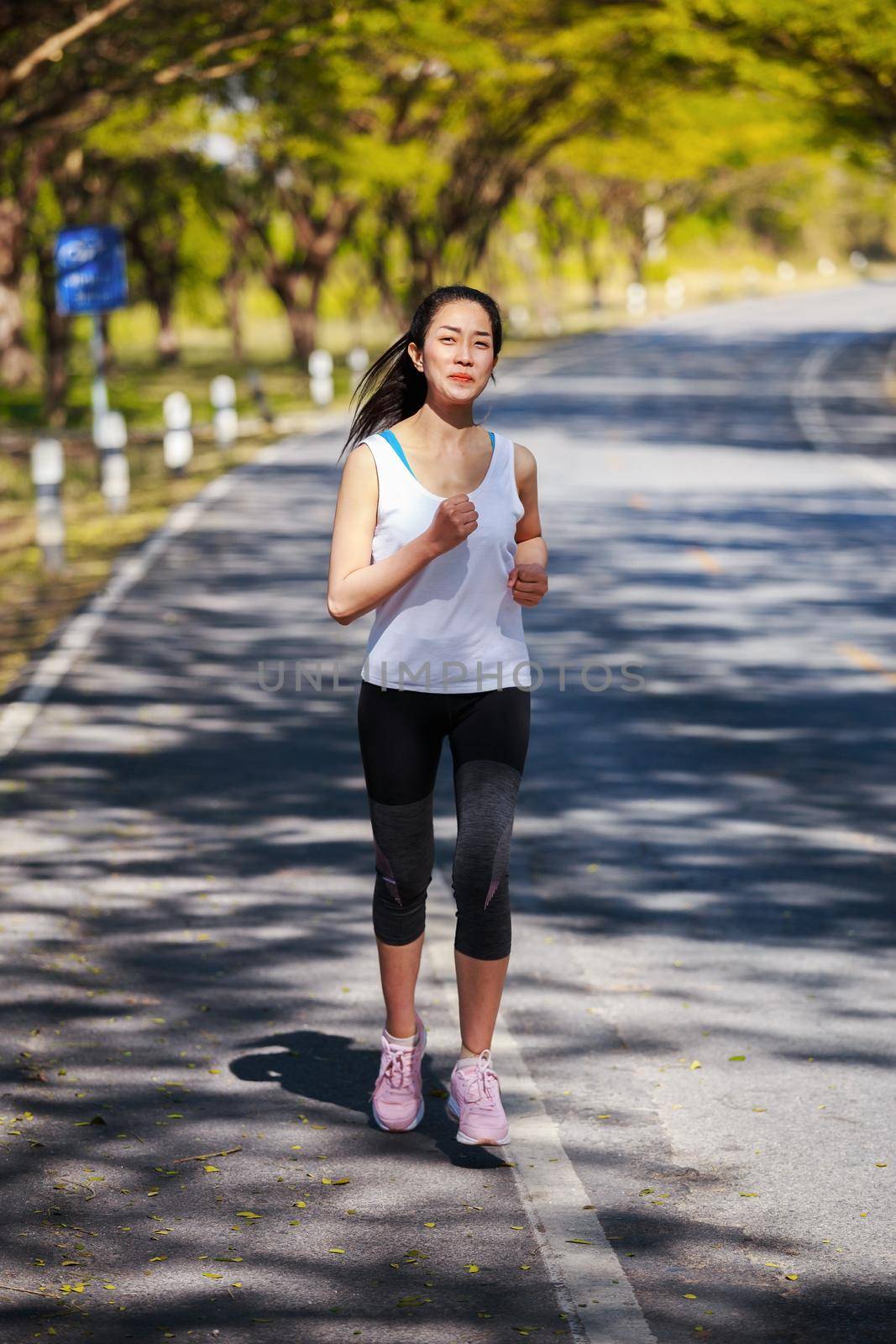 fitness woman running in park by geargodz