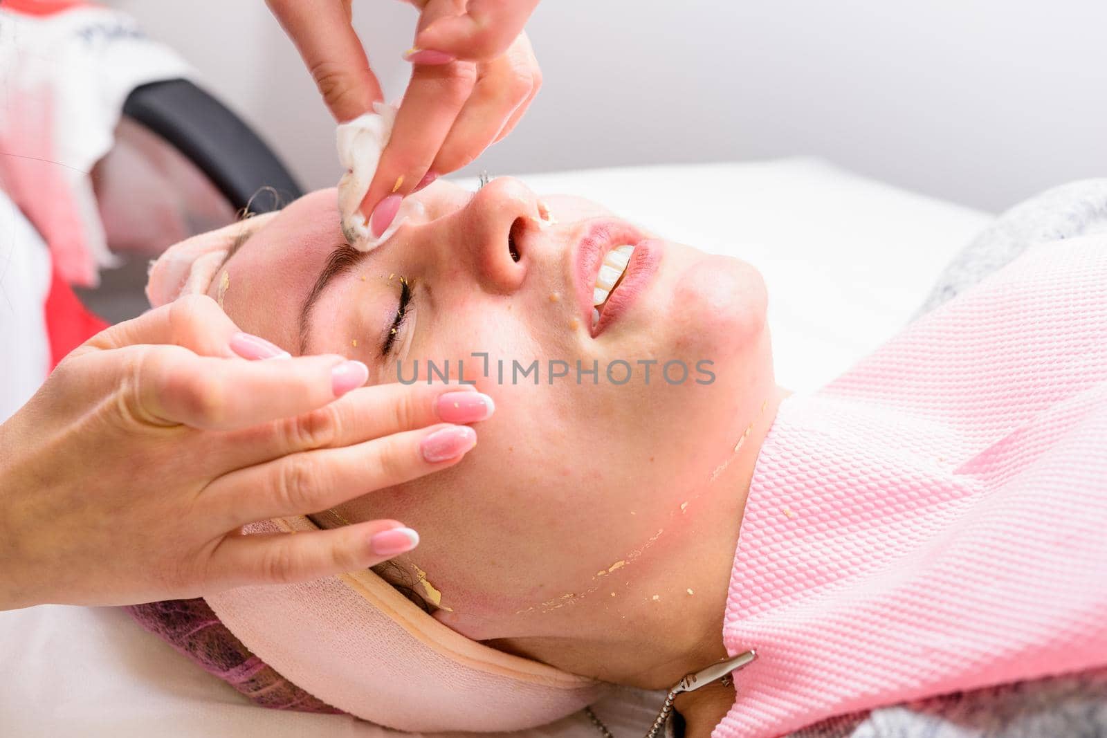 Facial massage at the beautician at the reception, visiting a beauty salon, a sense of relaxation. new