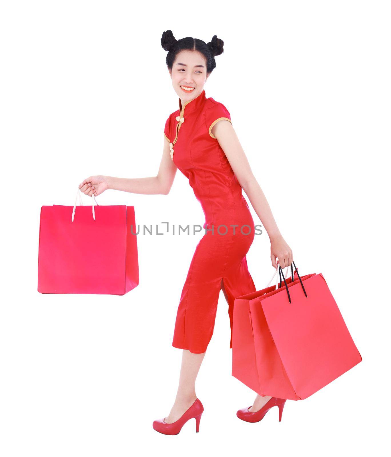 happy woman holding shopping bag on chinese new year celebration isolated on white background