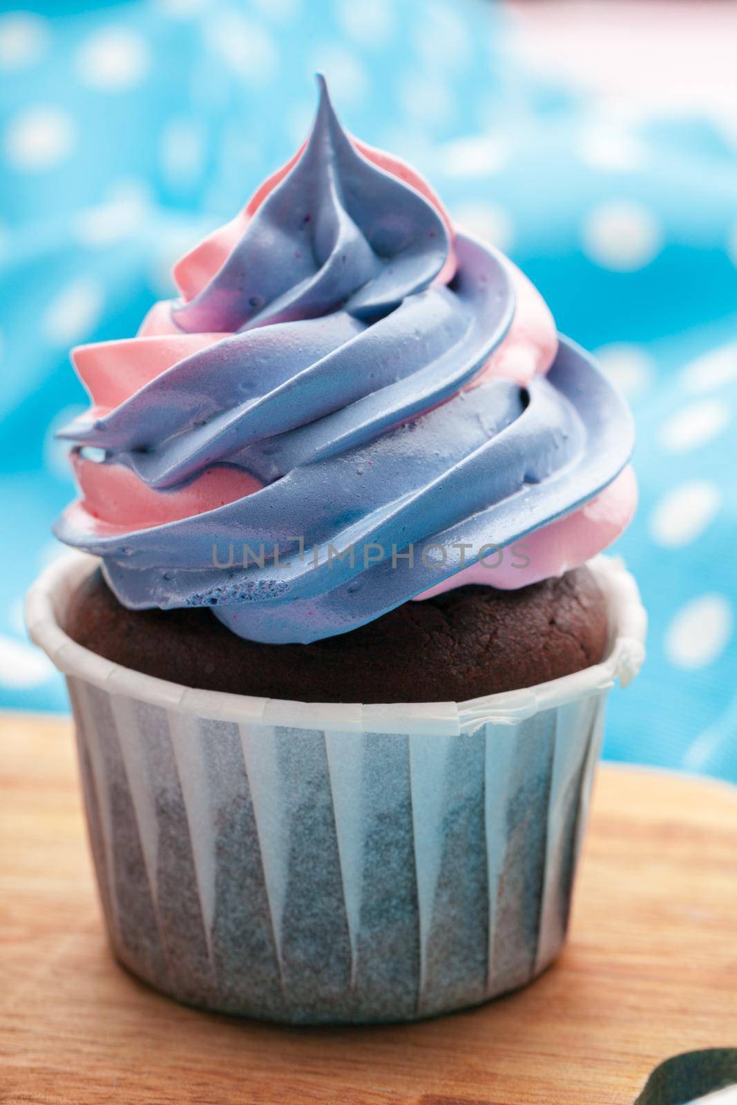 Side view of yummy cupcakes with assorted flavor. Shot on the table