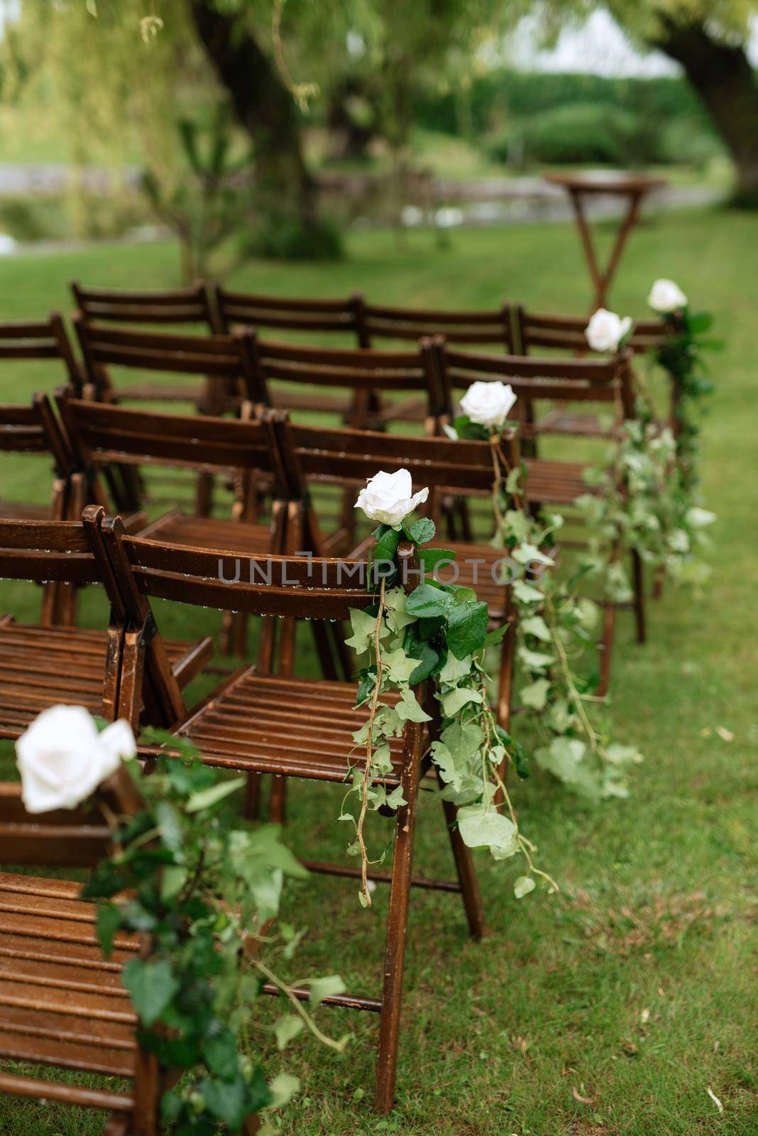 wedding ceremony area with dried flowers in a meadow in a green forest