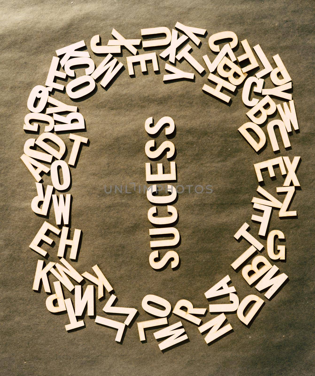 Success Word In Wooden Cube Alphabet Letters Top View On A rustic paper Background. by sudiptabhowmick