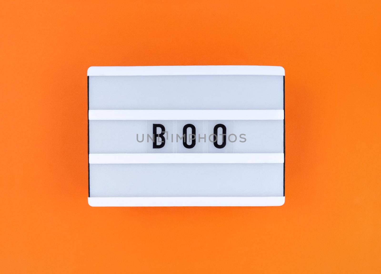 Light box with Boo word on orange background.