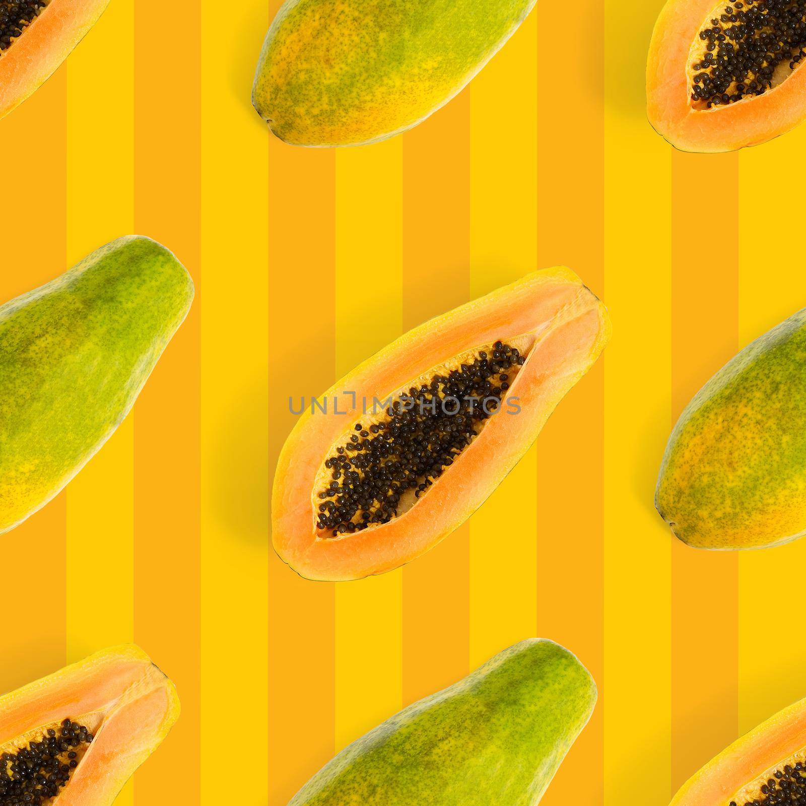 Fresh ripe papaya seamless pattern on orange background. Tropical abstract background. Top view. by PhotoTime
