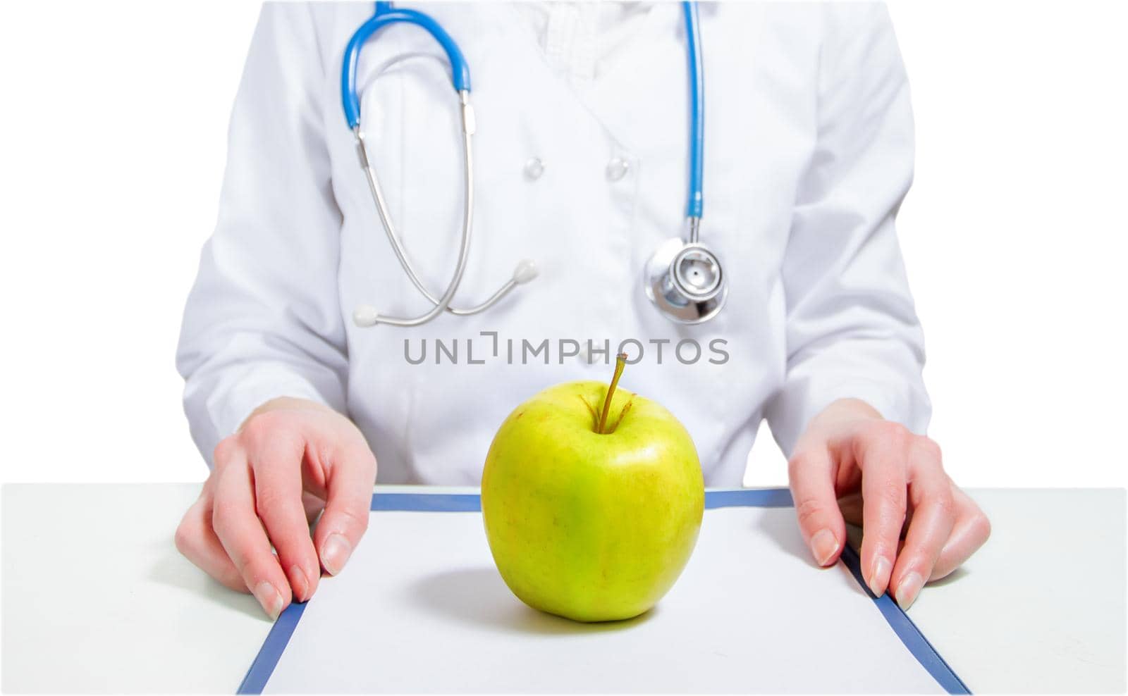 Apple on list, on the background of a woman doctor