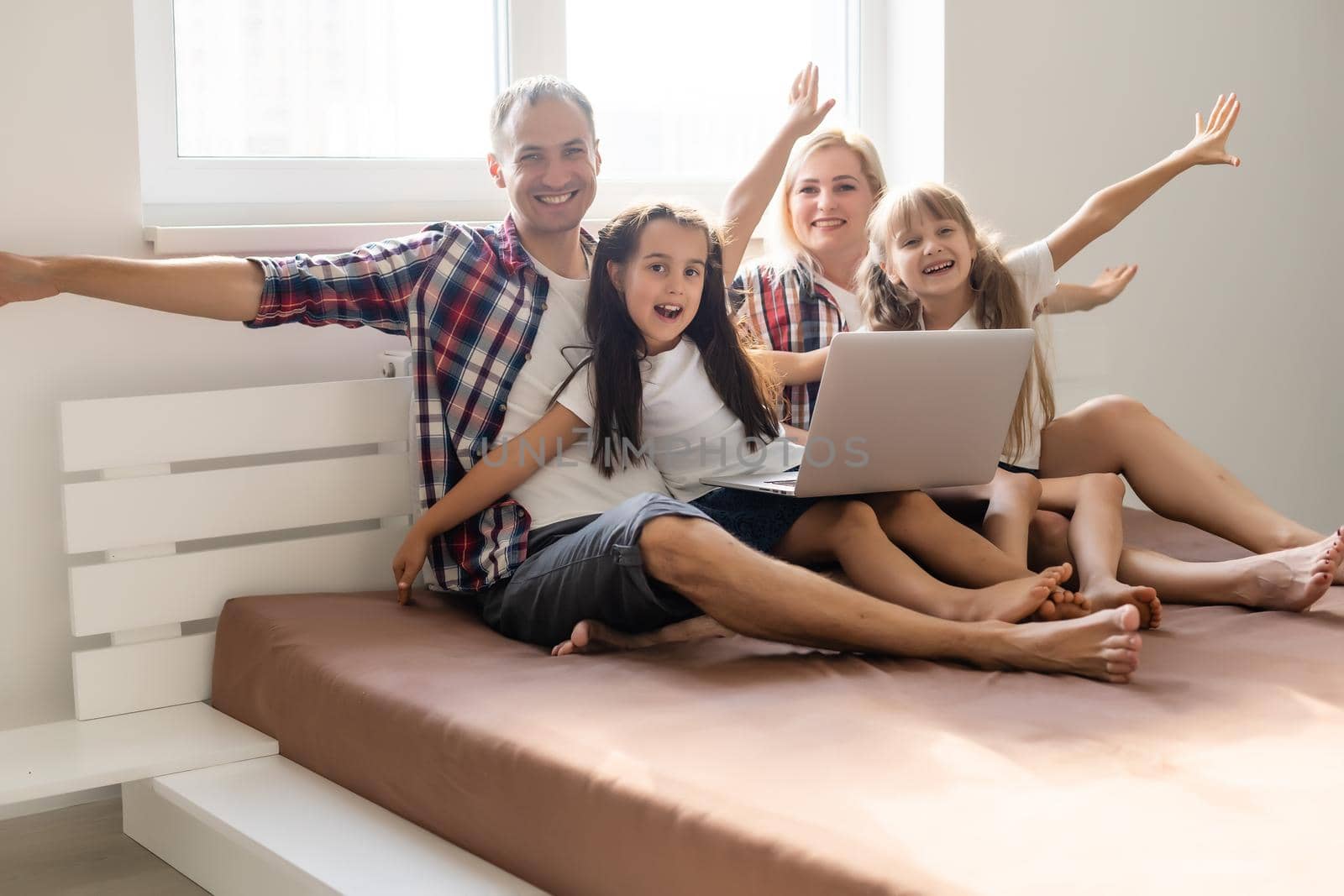 Animated family buying online lying down on bed at home by Andelov13