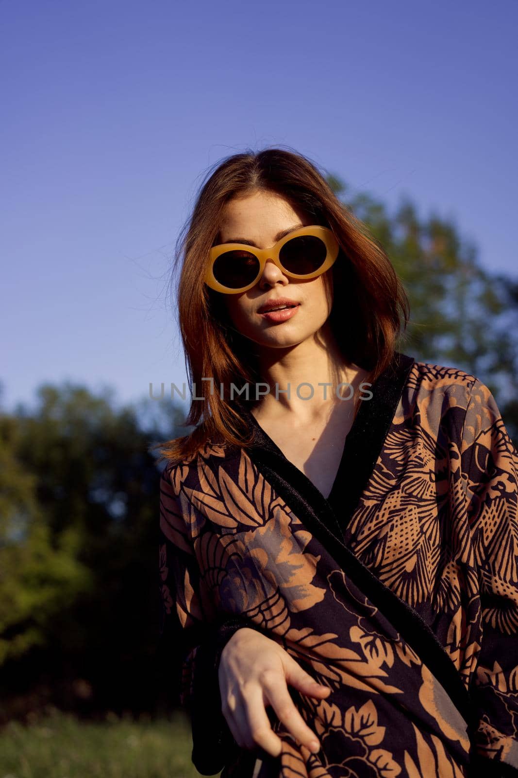 pretty woman in fashionable clothes sunglasses nature posing by Vichizh