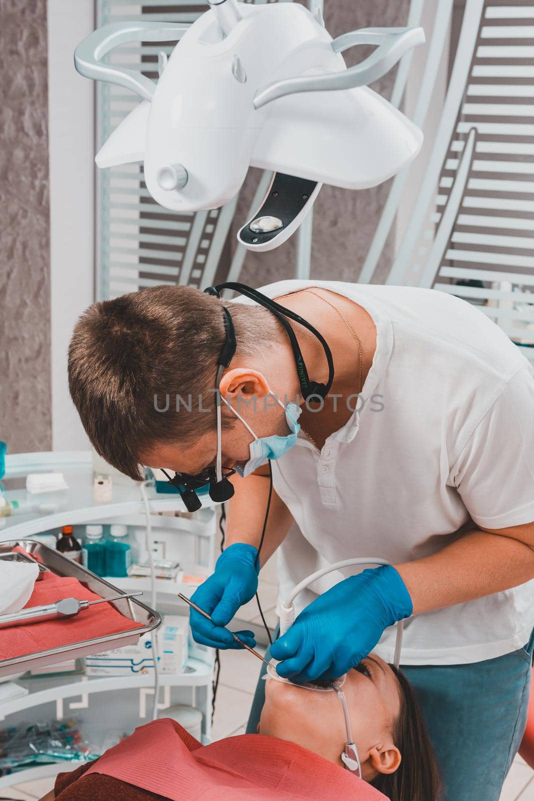 The dentist uses a scaler to remove tartar, oral hygiene.2020