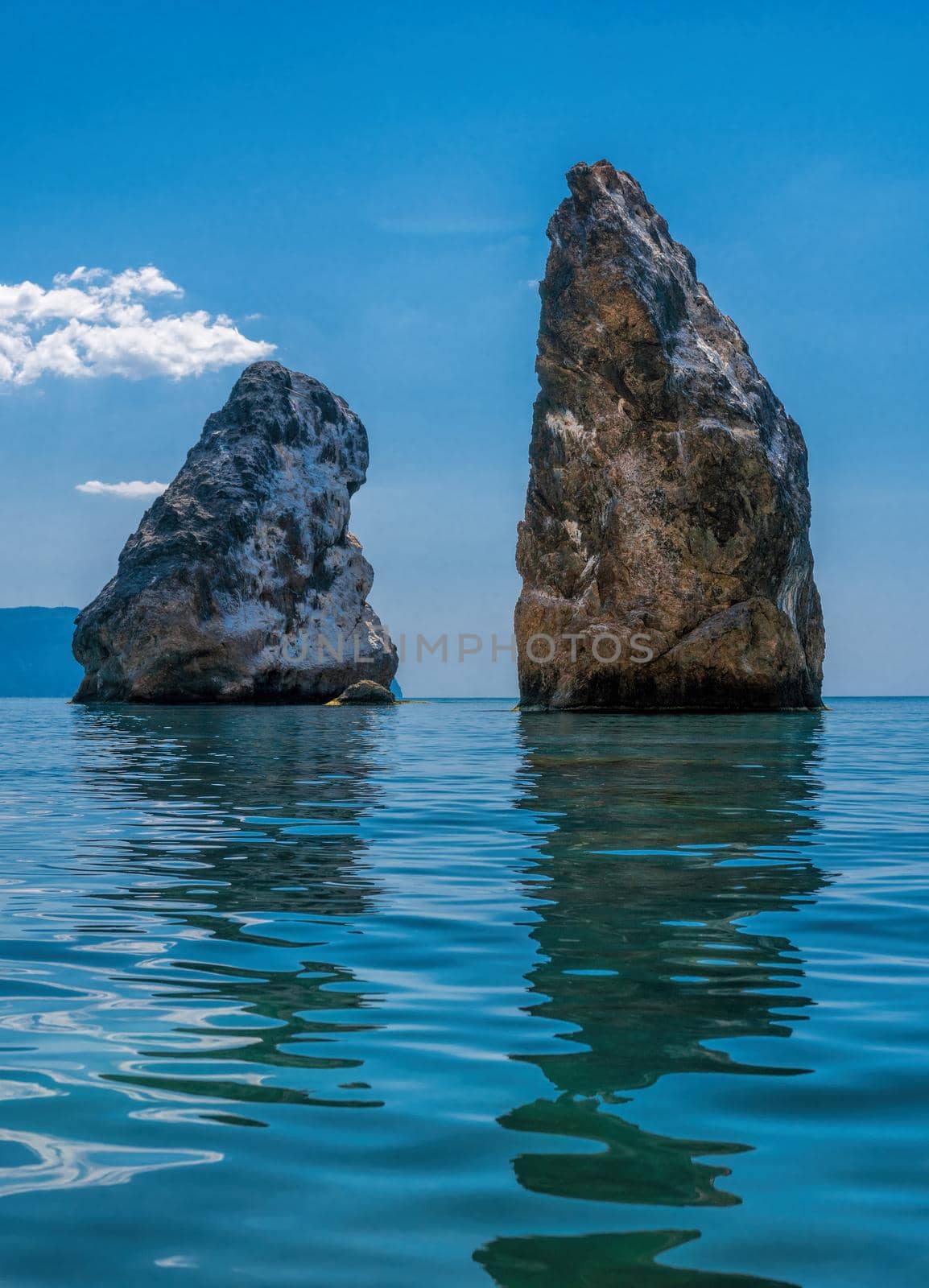 view on coastal cliffs, rock Orest and Pilad, cape Fiolent in Balaklava, Sevastopol Crimea. Bright sunny day, calm cristal clear blue sea. The concept of calmness silence and unity with nature. by panophotograph