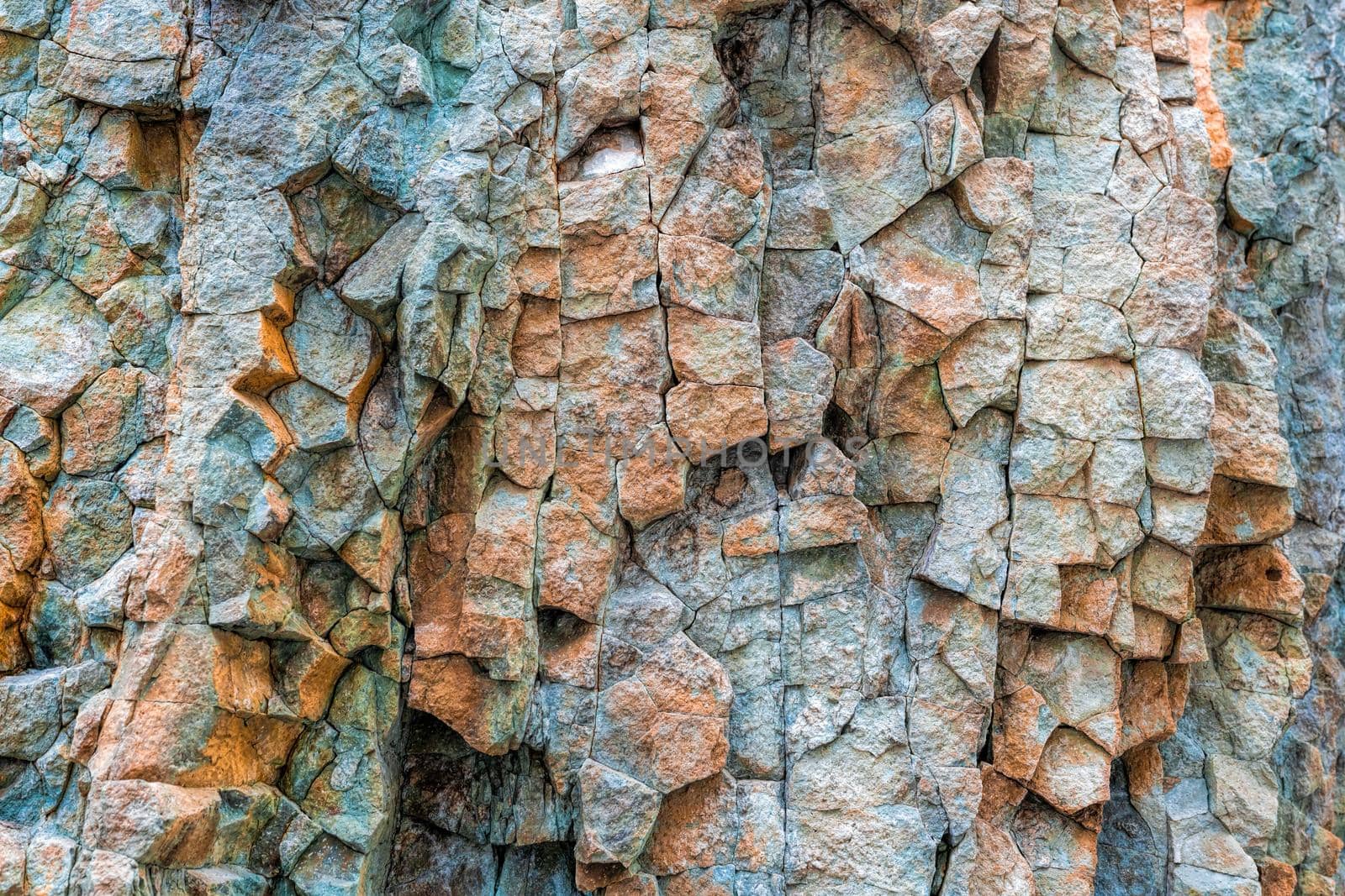 Abstract background from toned mountains texture, volcanic basalt as in Iceland. Lush lava color trend 2020. Bright colorful rock texture background for your design. Close-up.