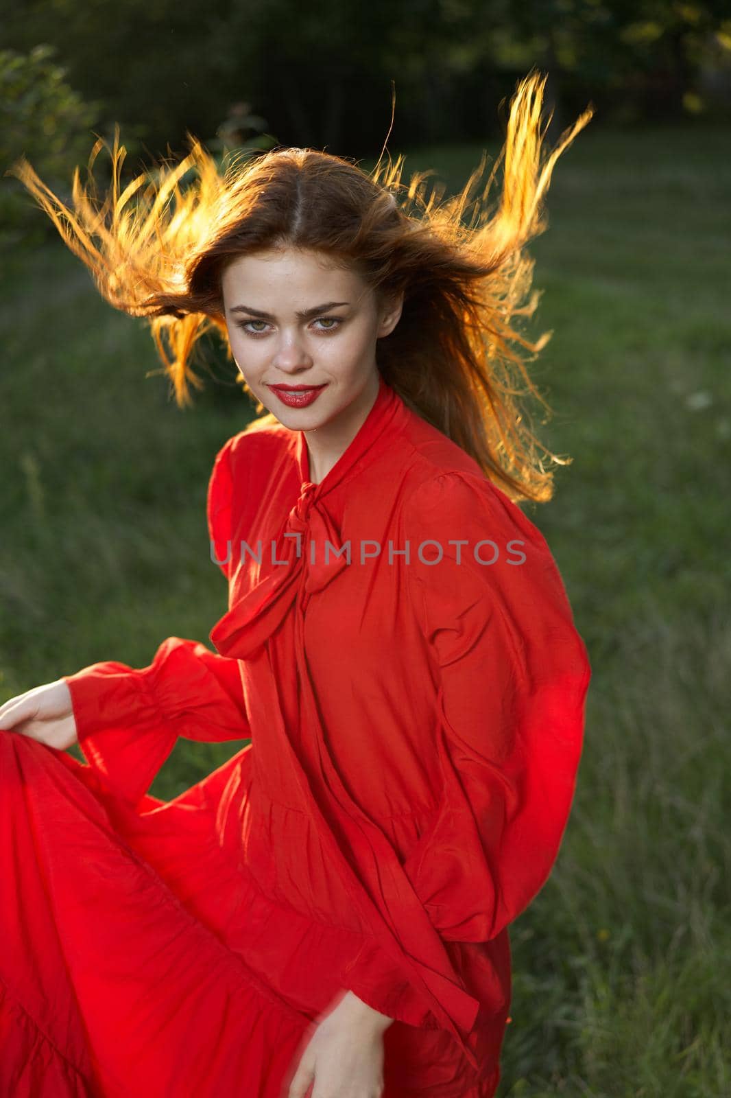 woman in red dress posing nature sun fun by Vichizh