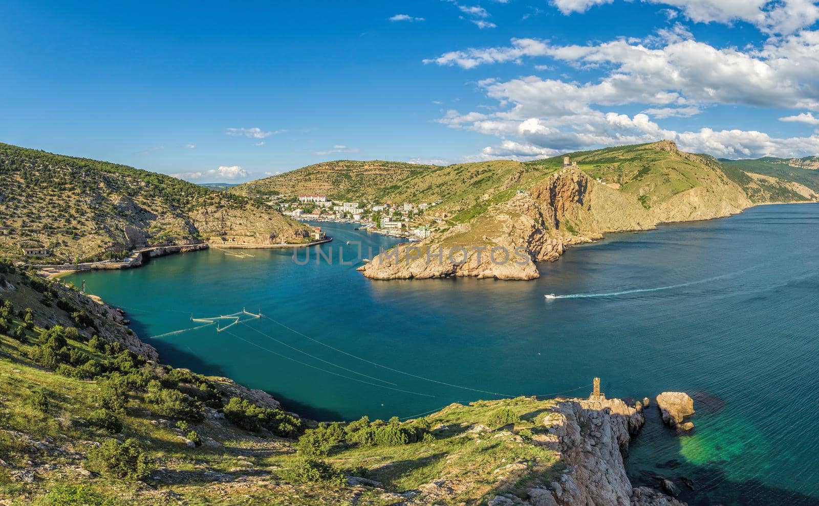 Scenic panoramic view of Balaclava bay with yachts from the ruines of Genoese fortress Chembalo. Balaklava, Sevastopol, Crimea. Inspirational travel landscape. Aerial photo. Copy space. by panophotograph
