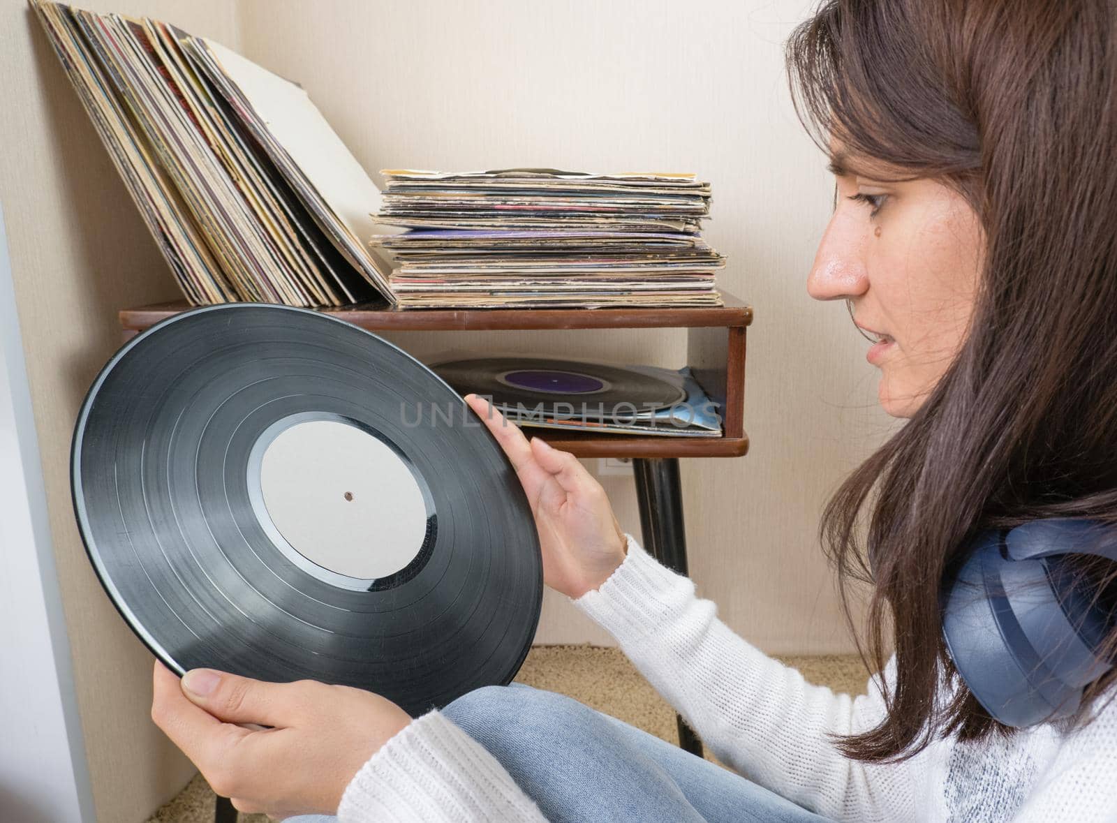 Playing vinyl records. Listening music, leisure time, staying home