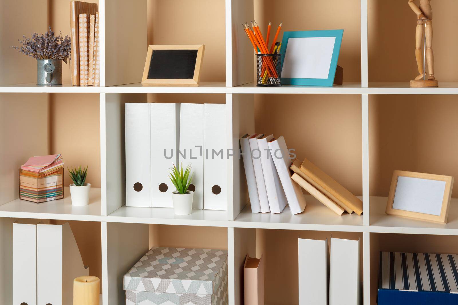 Home office working space. white shelf with accessories