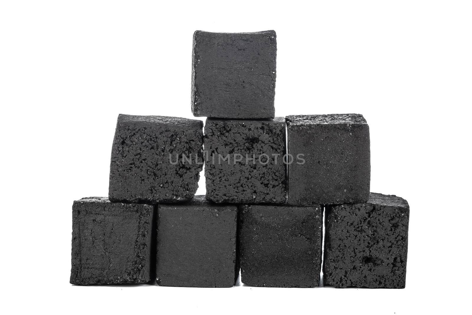 Group of charcoal cubes isolated on white background