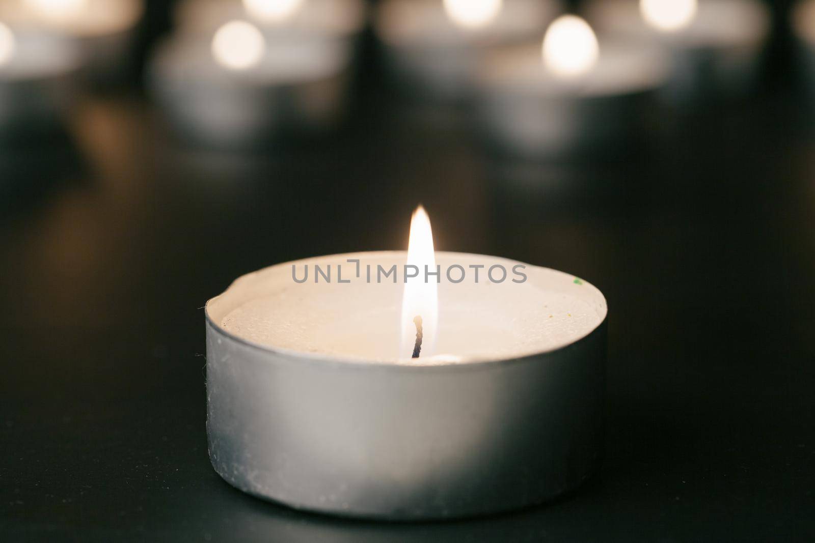 Candles Burning at Night. White Candles Burning in the Dark