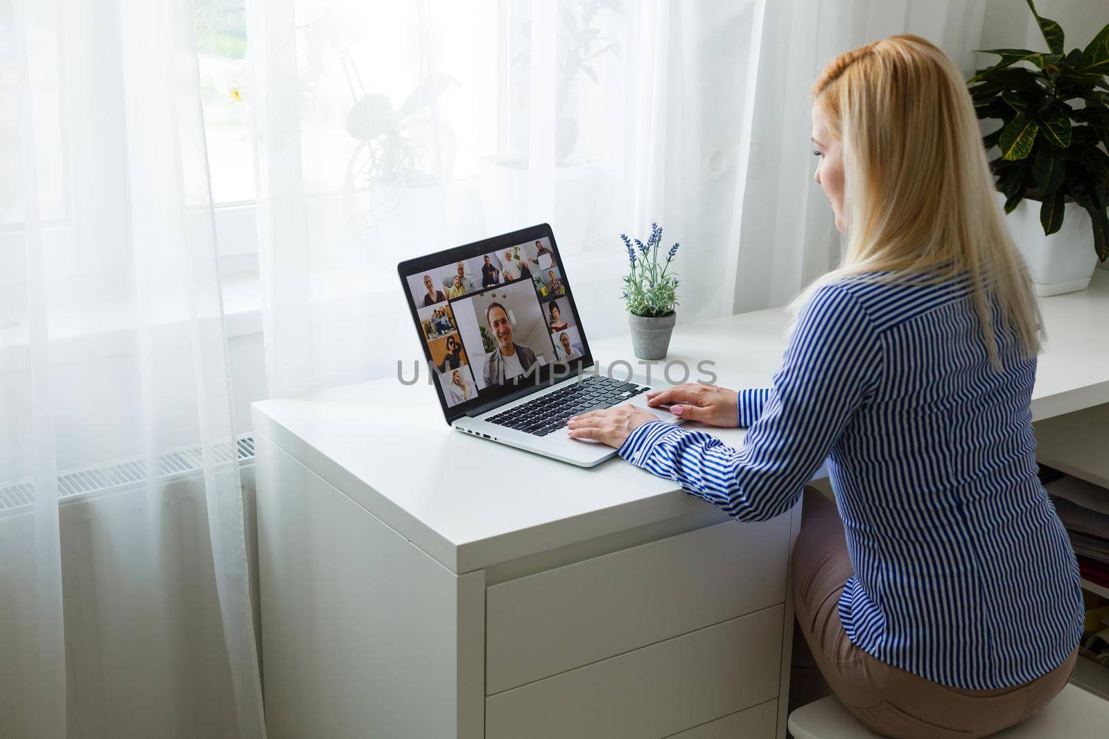 Conference room with video conference equipment and laptop