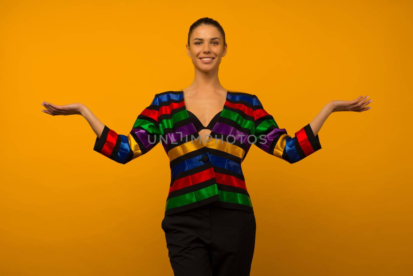 Young lesbian girl and an LGBT community representative posing in a flag coloring jacket LGBTQ shows something - image
