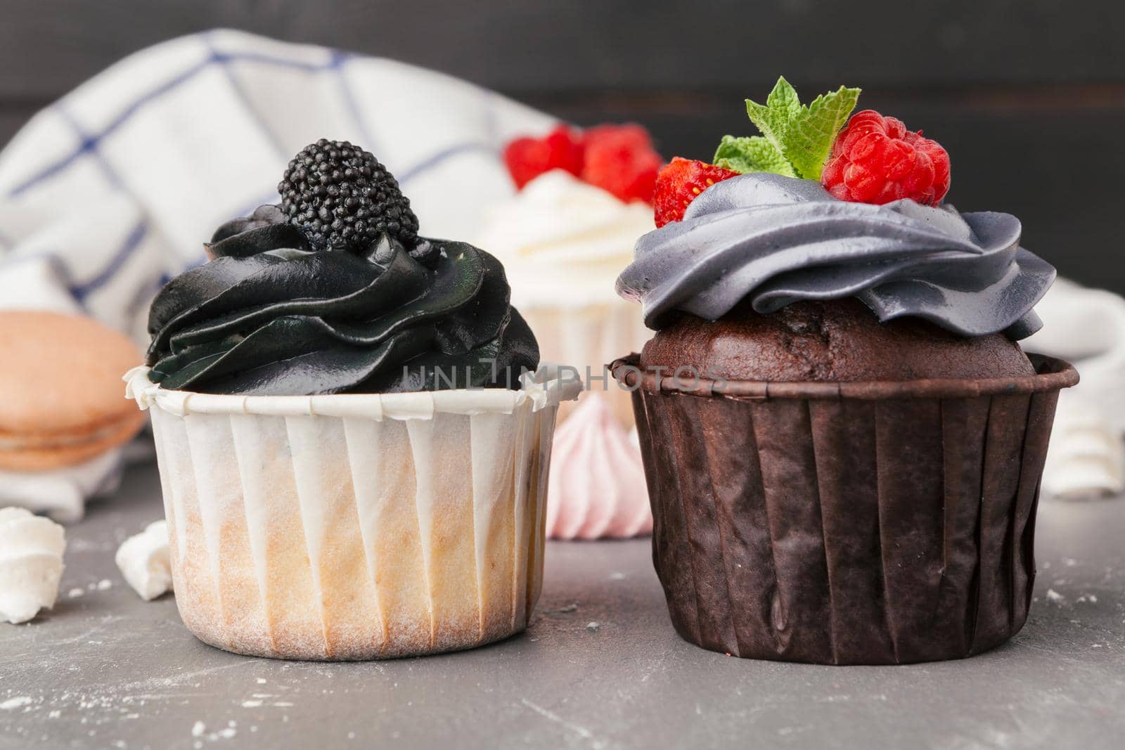 Delicious raspberry cupcakes on dark background - Handmade Sweet dessert
