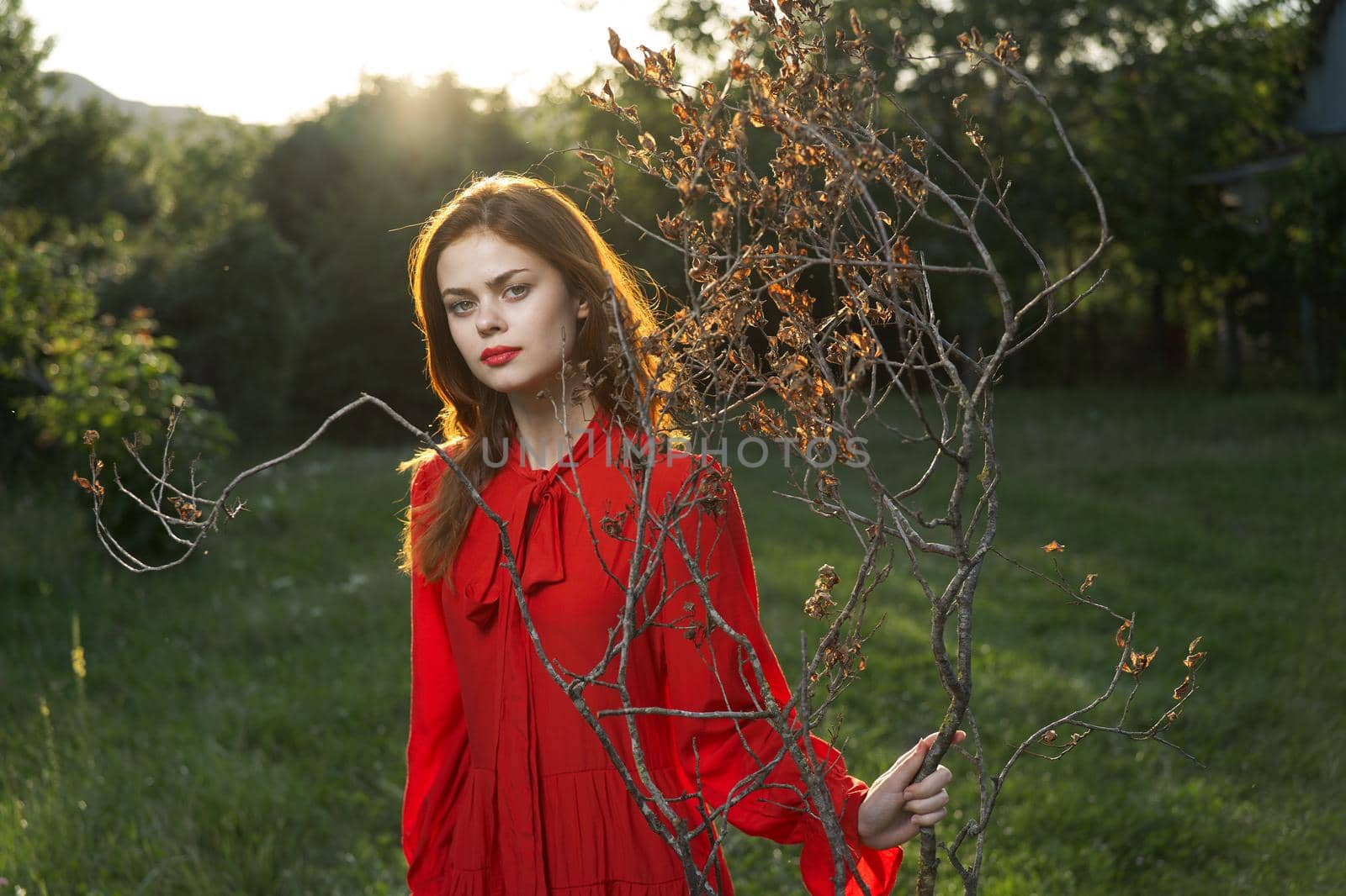 attractive woman in red dress outdoors fresh air summer by Vichizh