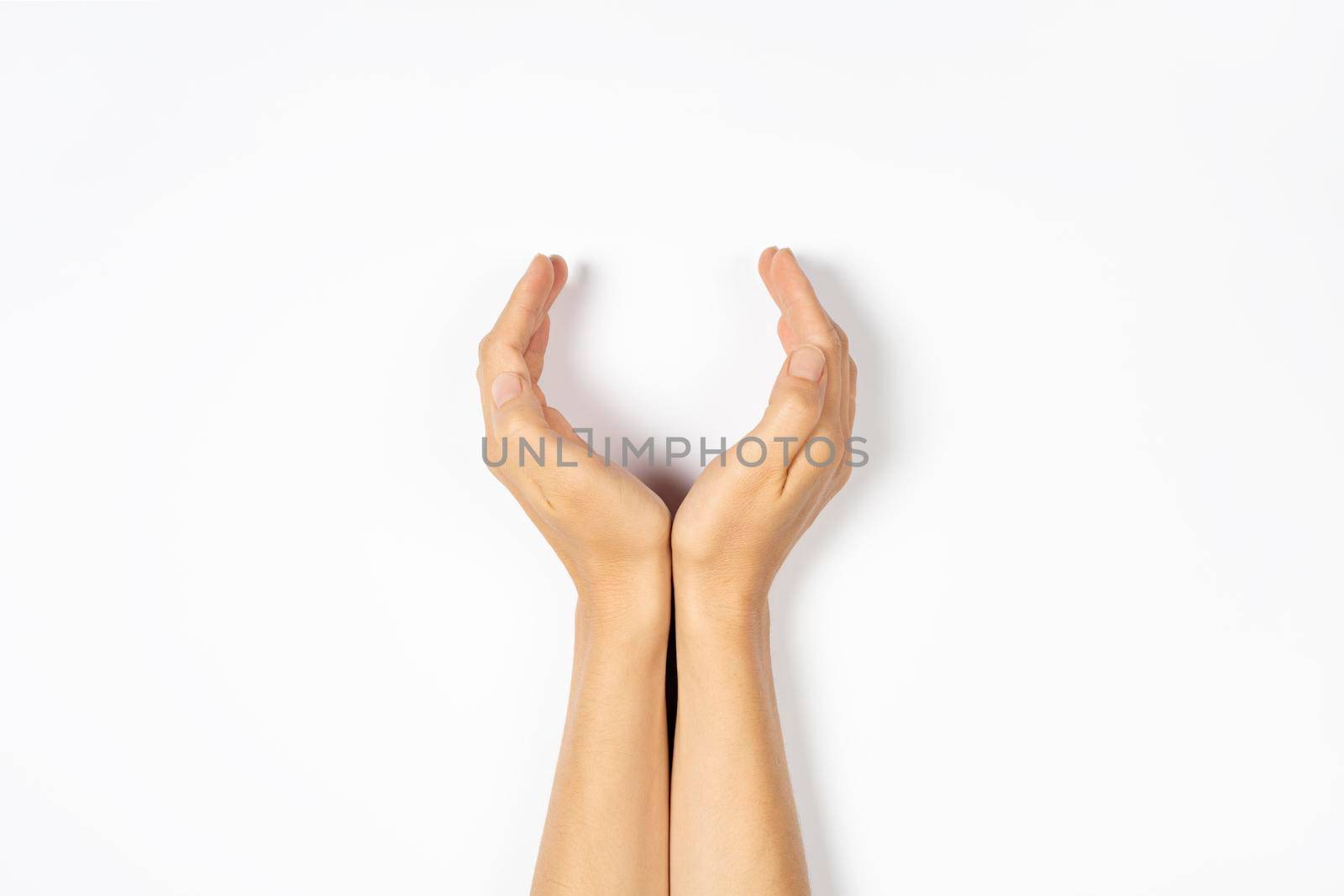 The palms are in a holding, offering or giving position isolated on white background. Open palm gesture.