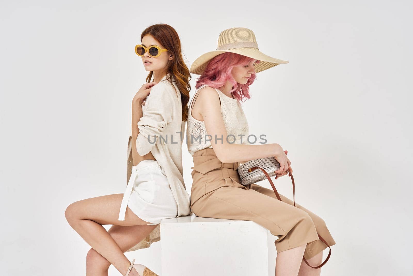 two women in fashionable clothes posing model decoration by Vichizh