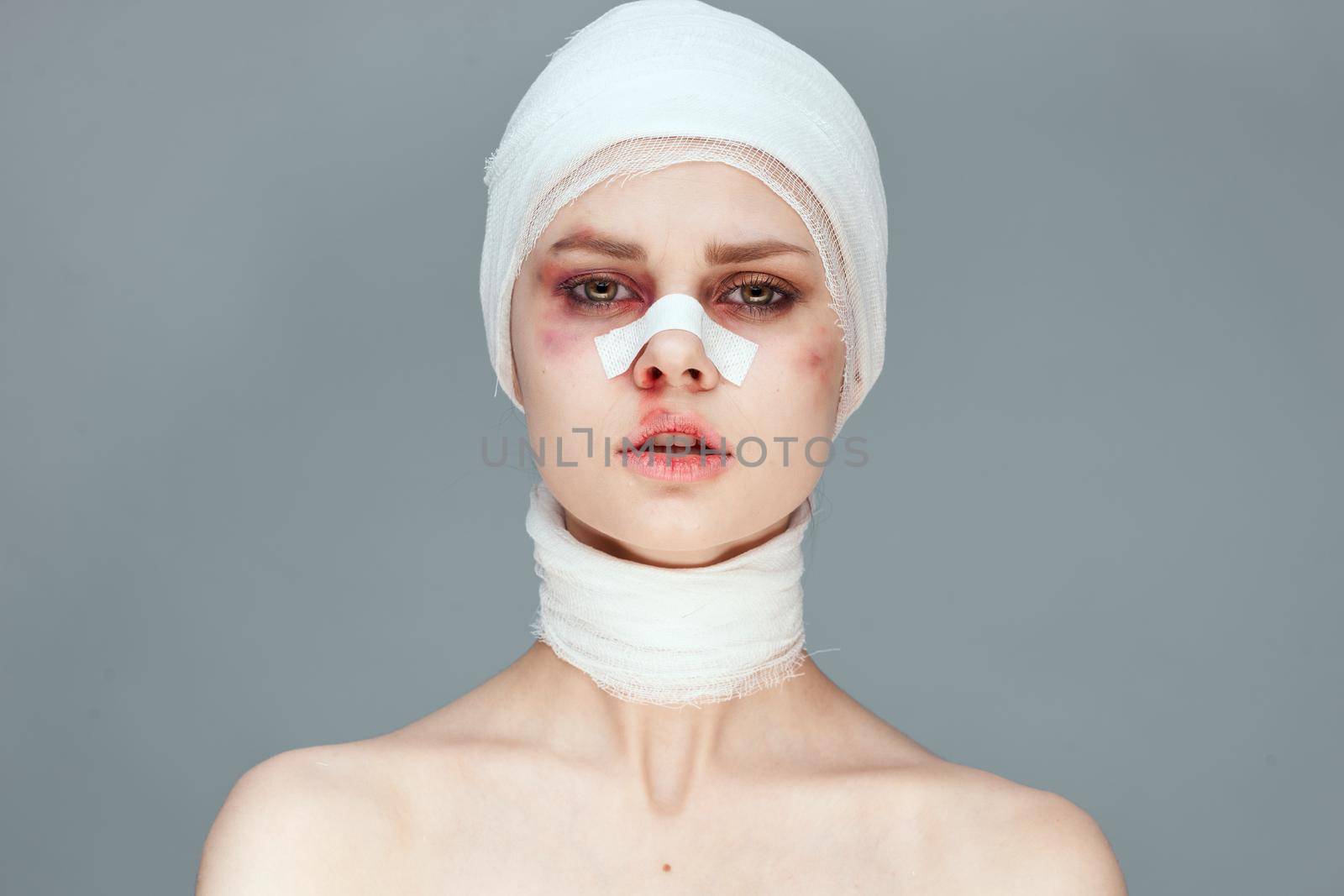 woman plastic surgery operation bare shoulders studio lifestyle. High quality photo
