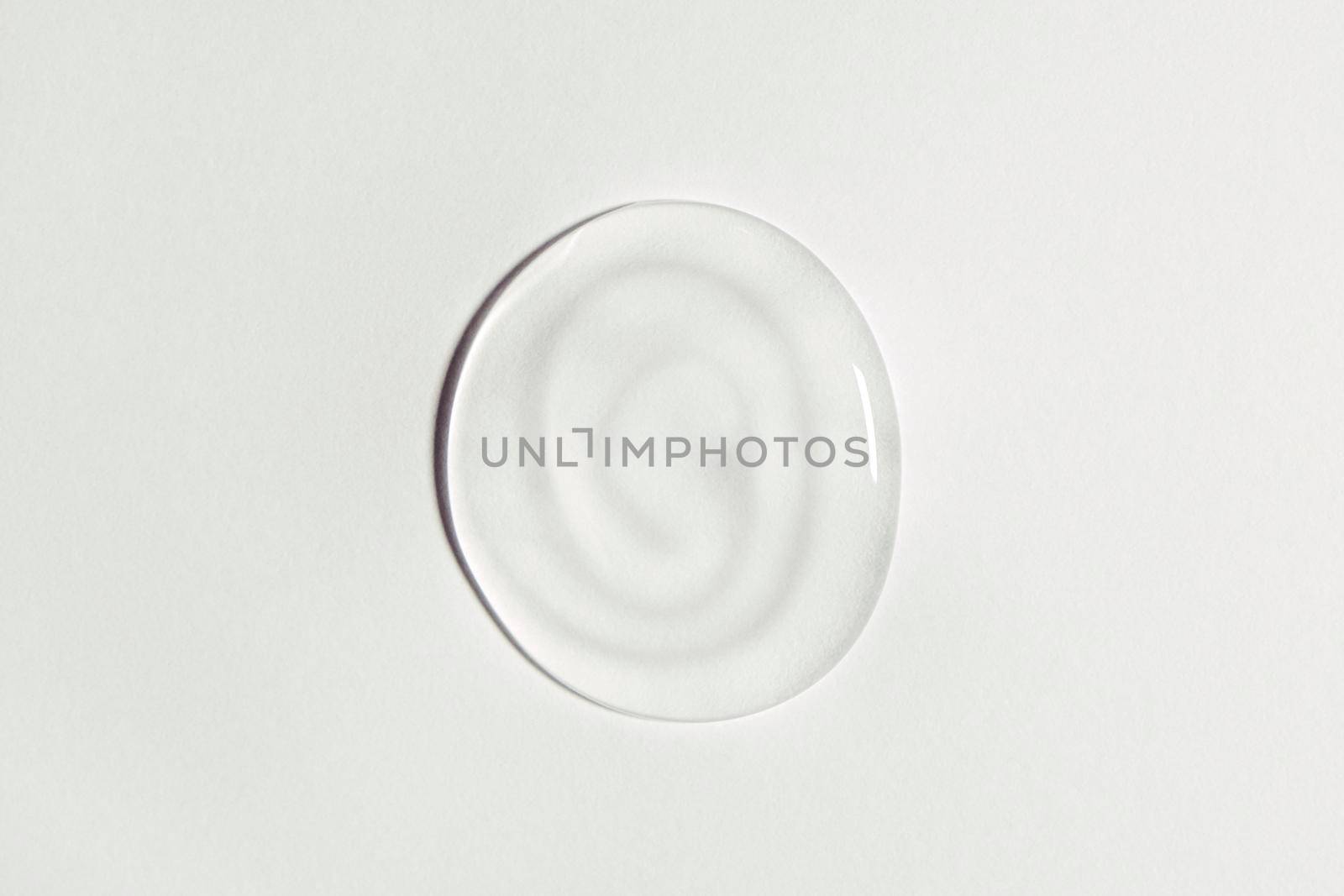 White transparent gel drop isolated on white background. Top view. Virus protection or cosmetics concept. Serum texture close up