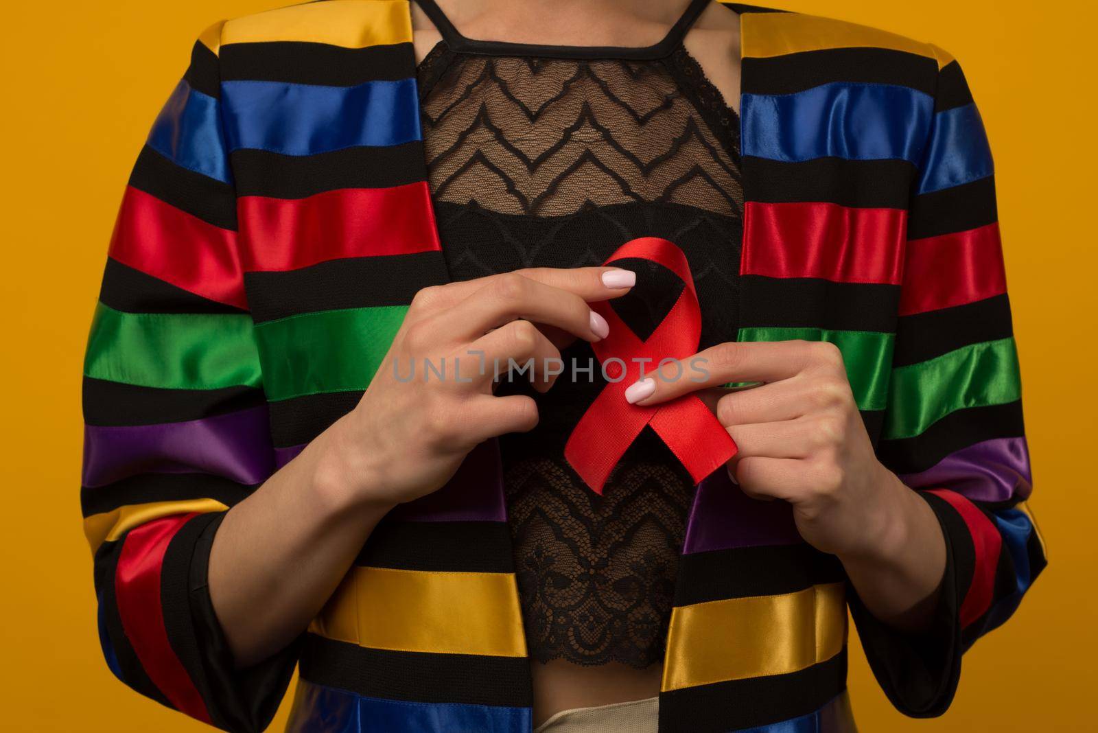 Woman Holds Red Ribbon to awareness world aids day Dec. 1 - image