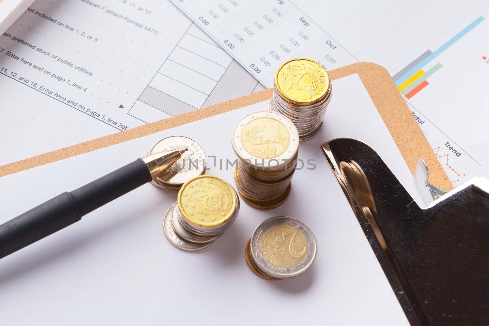 Saving stack coins money concept. Graph, chart document close up