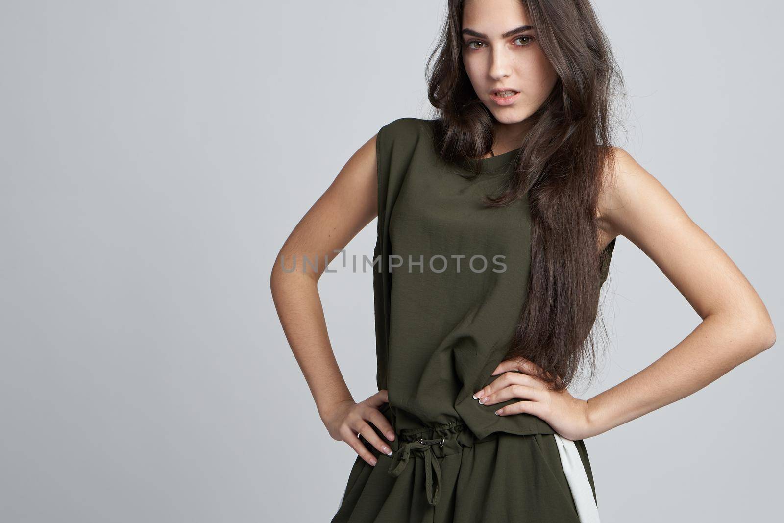 portrait of a woman fashion clothing posing light background. High quality photo