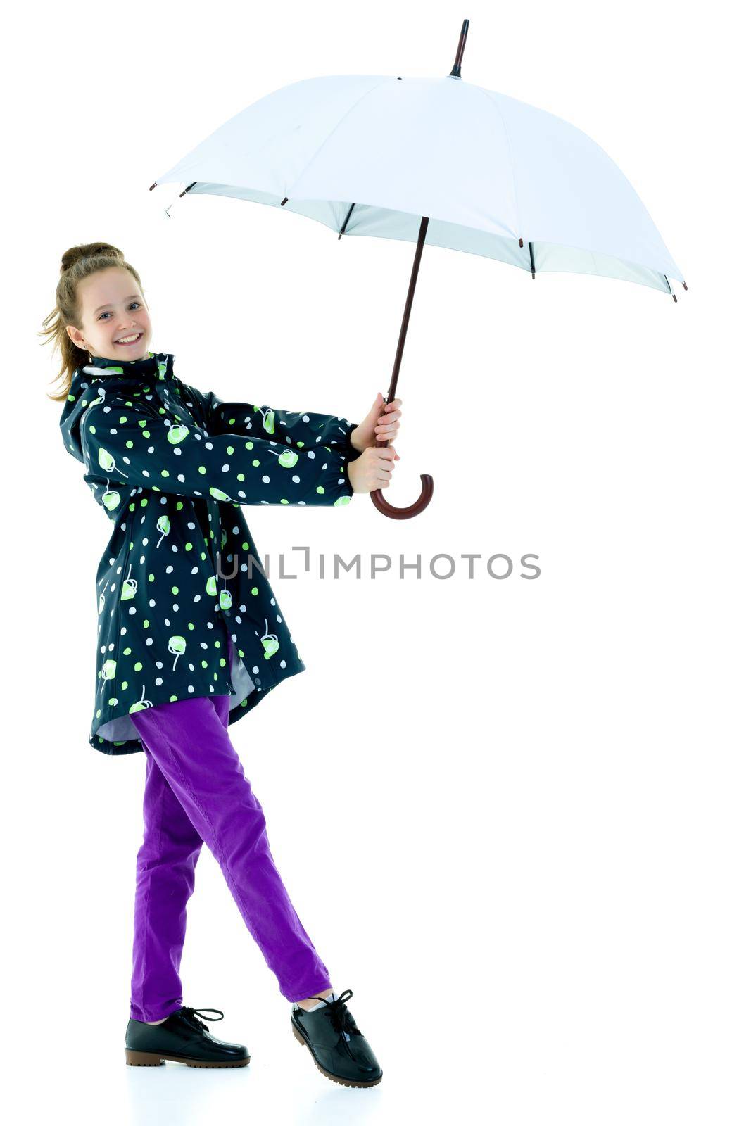 Beautiful little girl with umbrella. Concept of weather, climate change. Isolated on white background