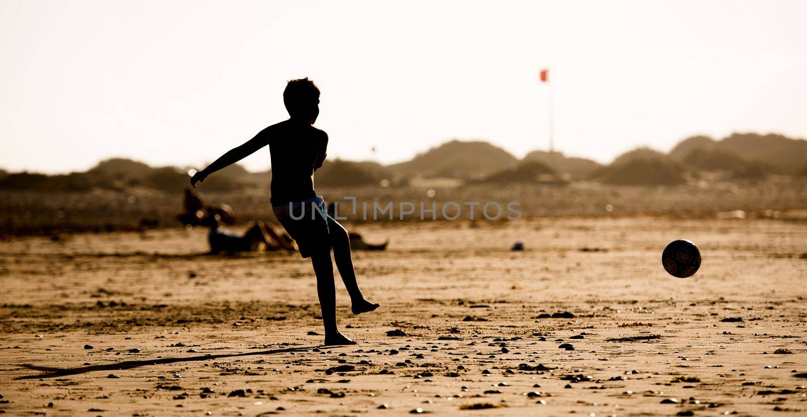 Silhouette of boy on the beach by GekaSkr