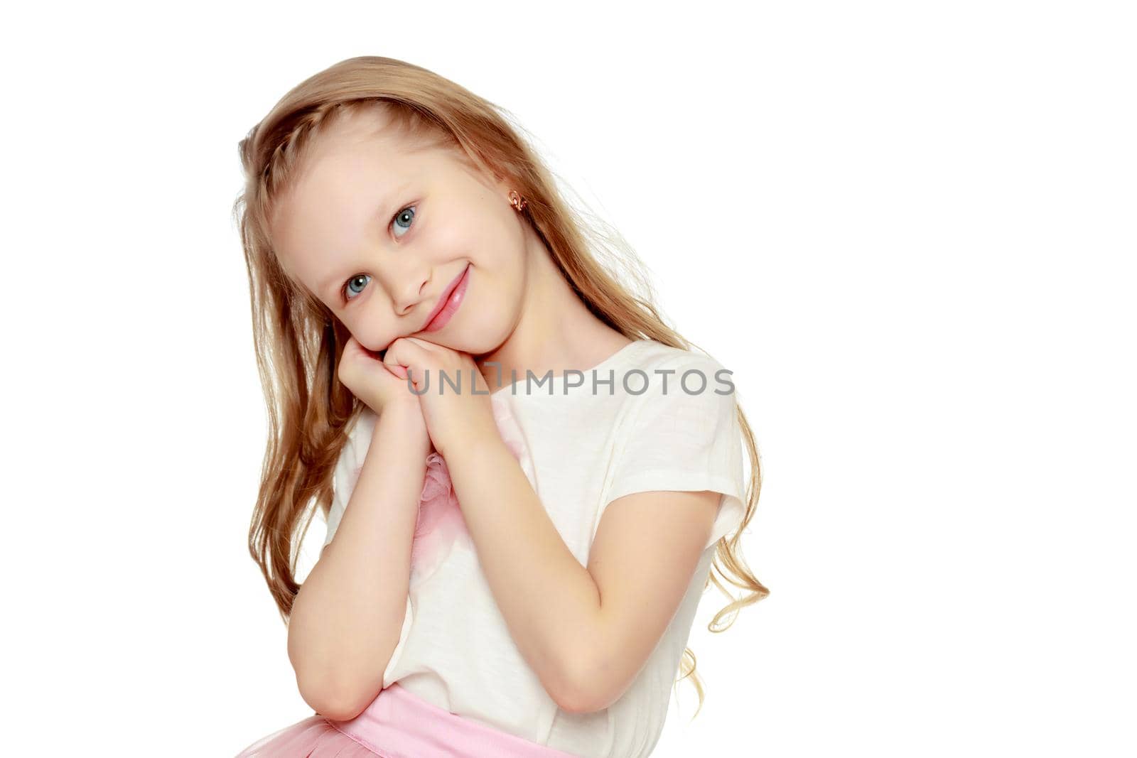 little blonde girl with long hair.In a lush short pink skirt and white T-shirt.Isolated on white background.