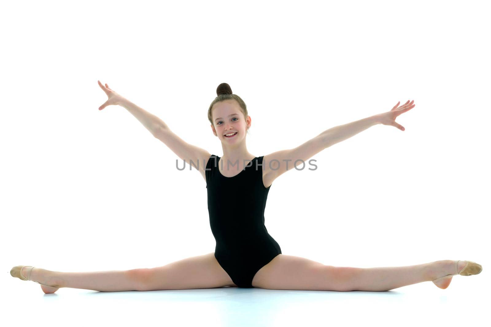 Girl gymnast perform the twine exercise. by kolesnikov_studio