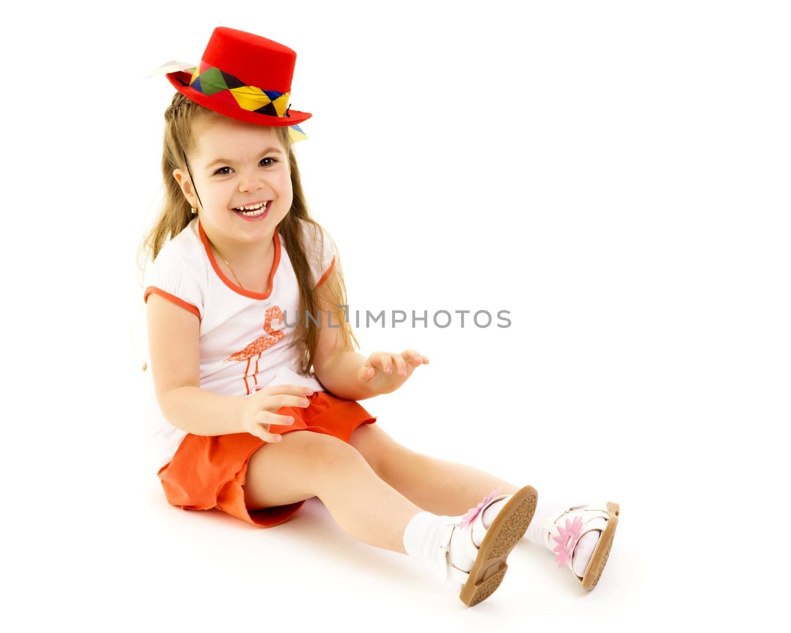 Beautiful little girl laughing. The concept of a happy childhood, emotions. Isolated on white background.