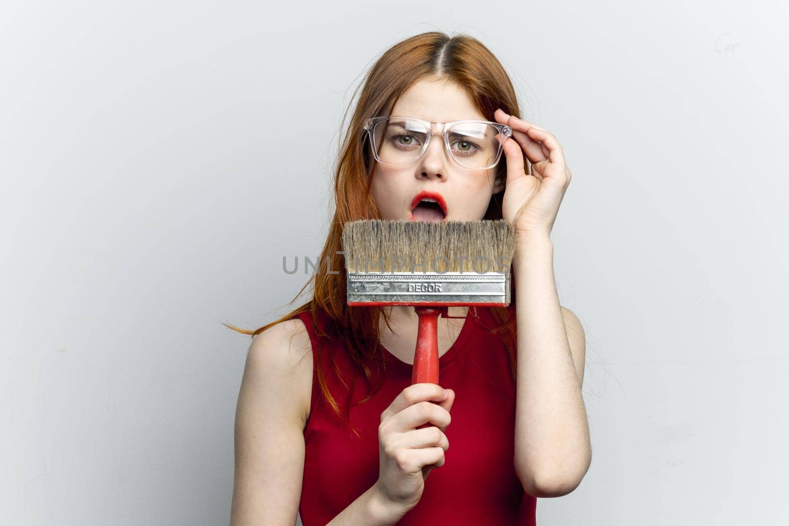 Woman in red t-shirt brush for paint rendering of repair service by Vichizh