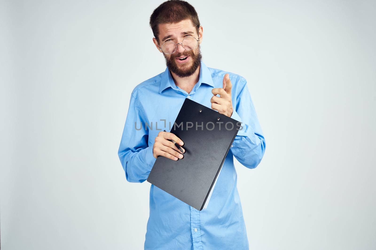 manager in blue shirt wearing glasses success emotions Professional. High quality photo