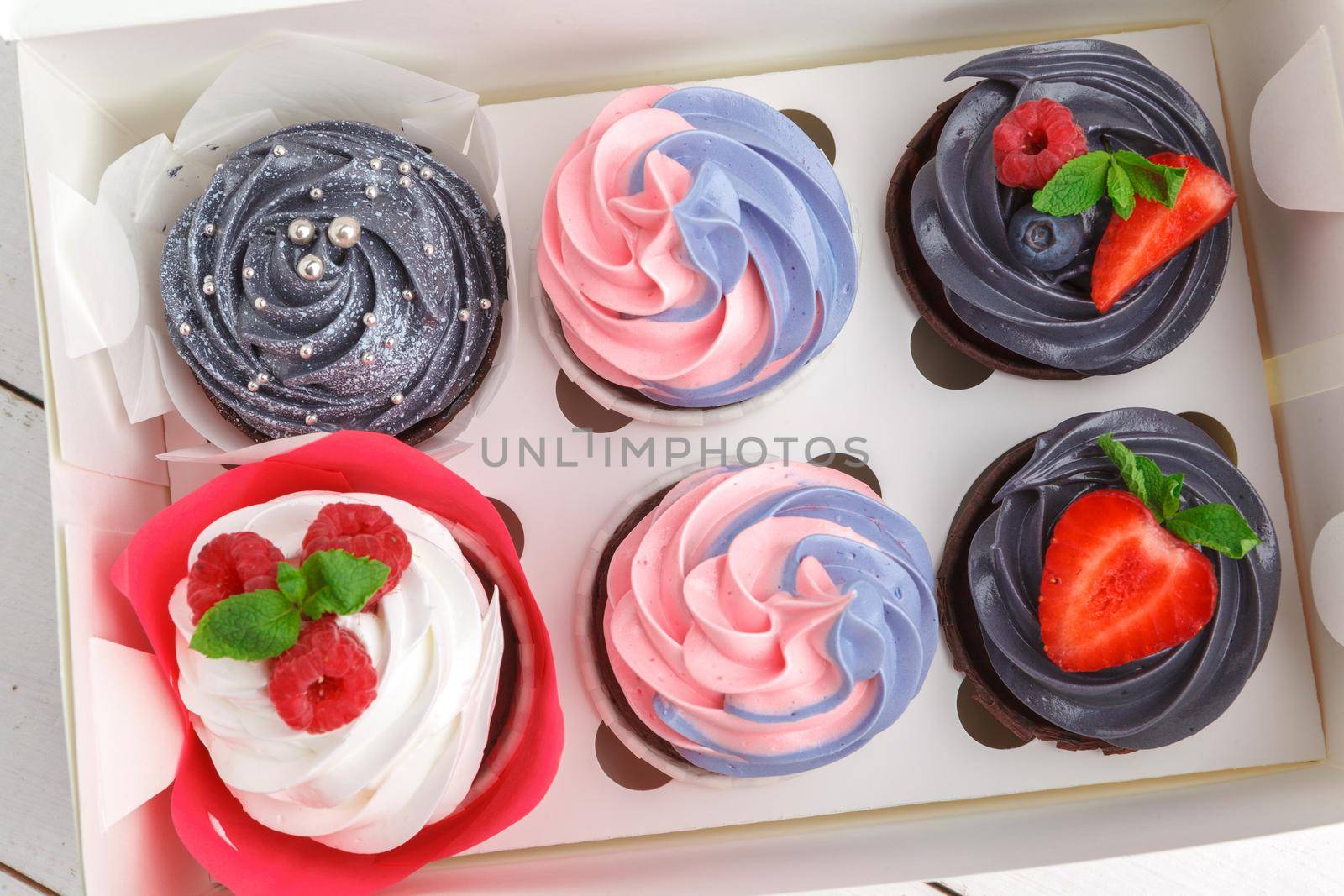 delicious cupcakes on a colored background. Festive background, birthday