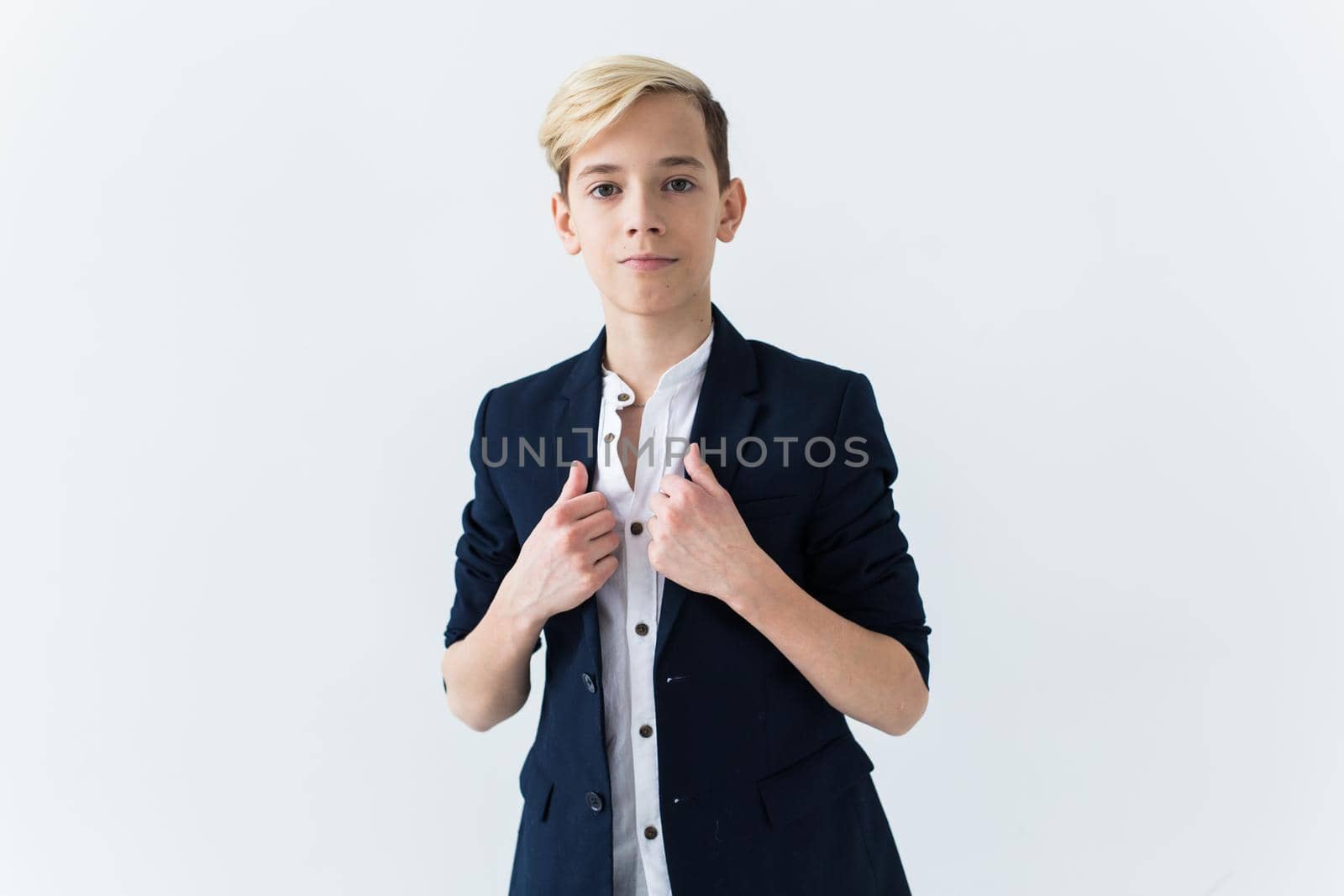 Teenage boy portrait on a white background.