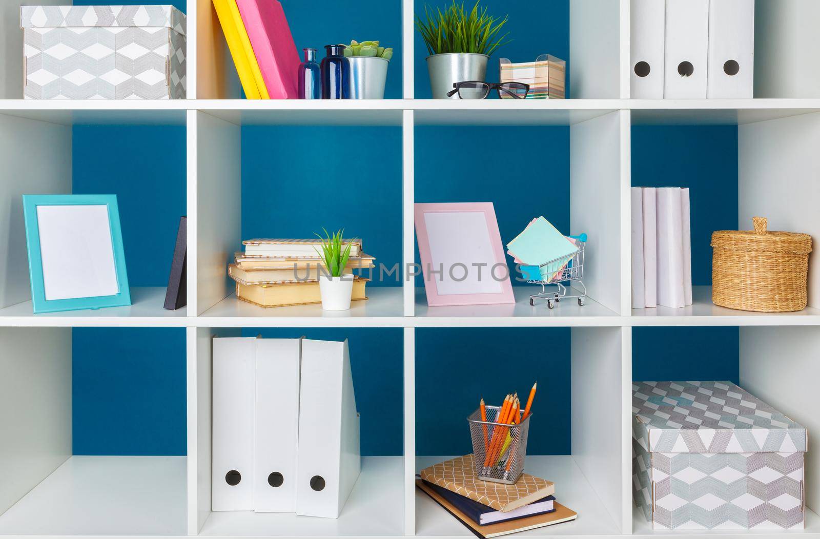 Stacks of supplies and paperwork in the office and bookshelves