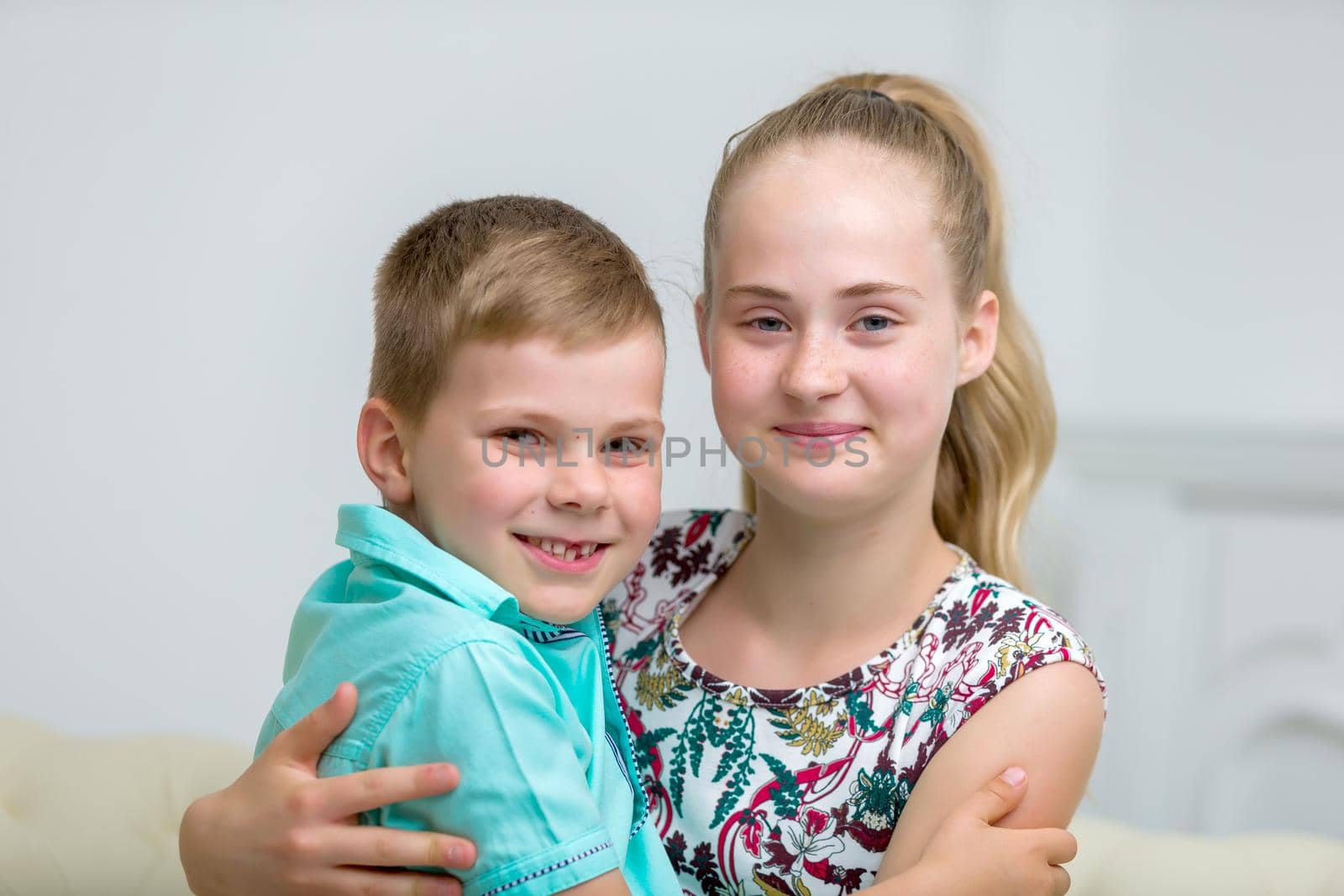 Brother and sister, boy and girl posing in the studio. Friendship concept. by kolesnikov_studio