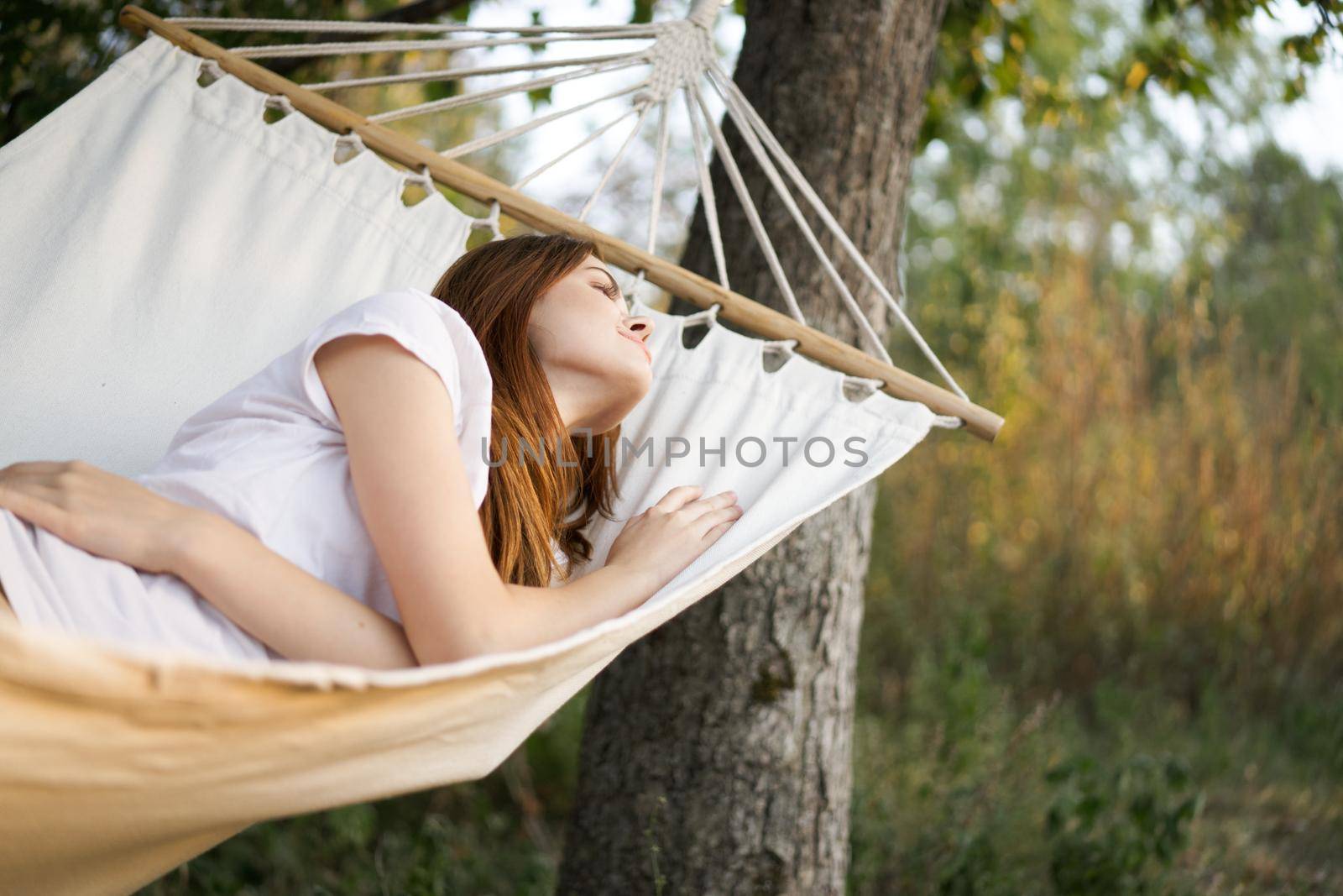 woman sleeping outdoors fresh air vacation travel by Vichizh