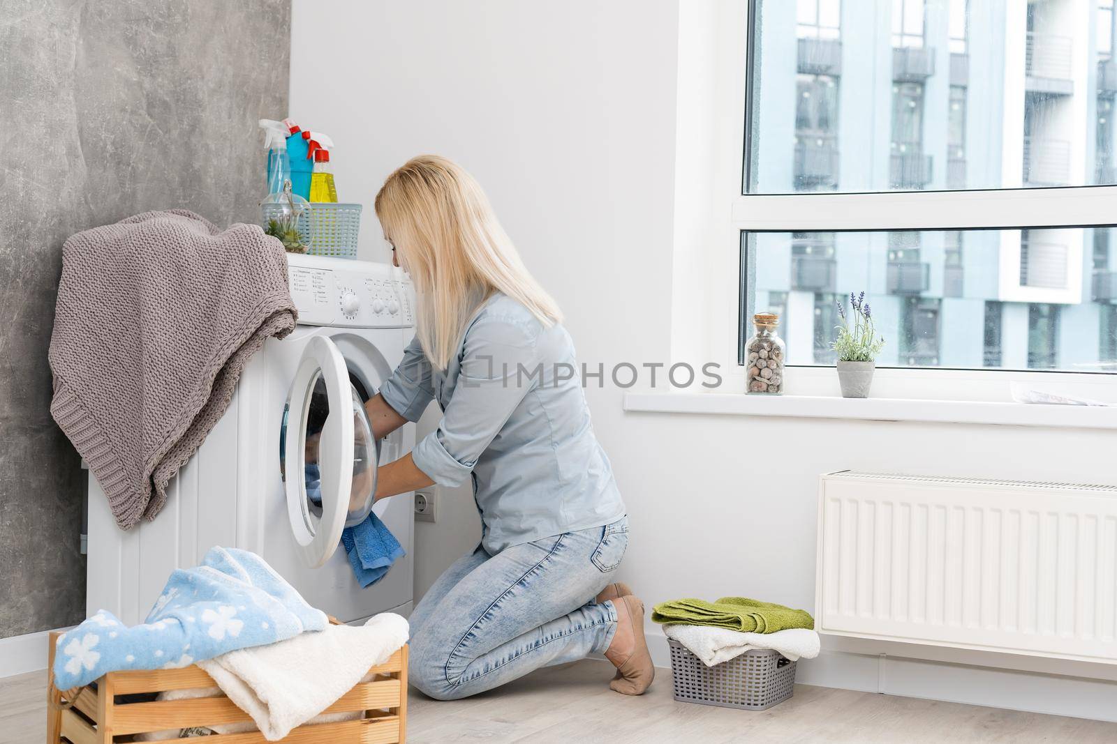 pretty smiling girl in the laundry room