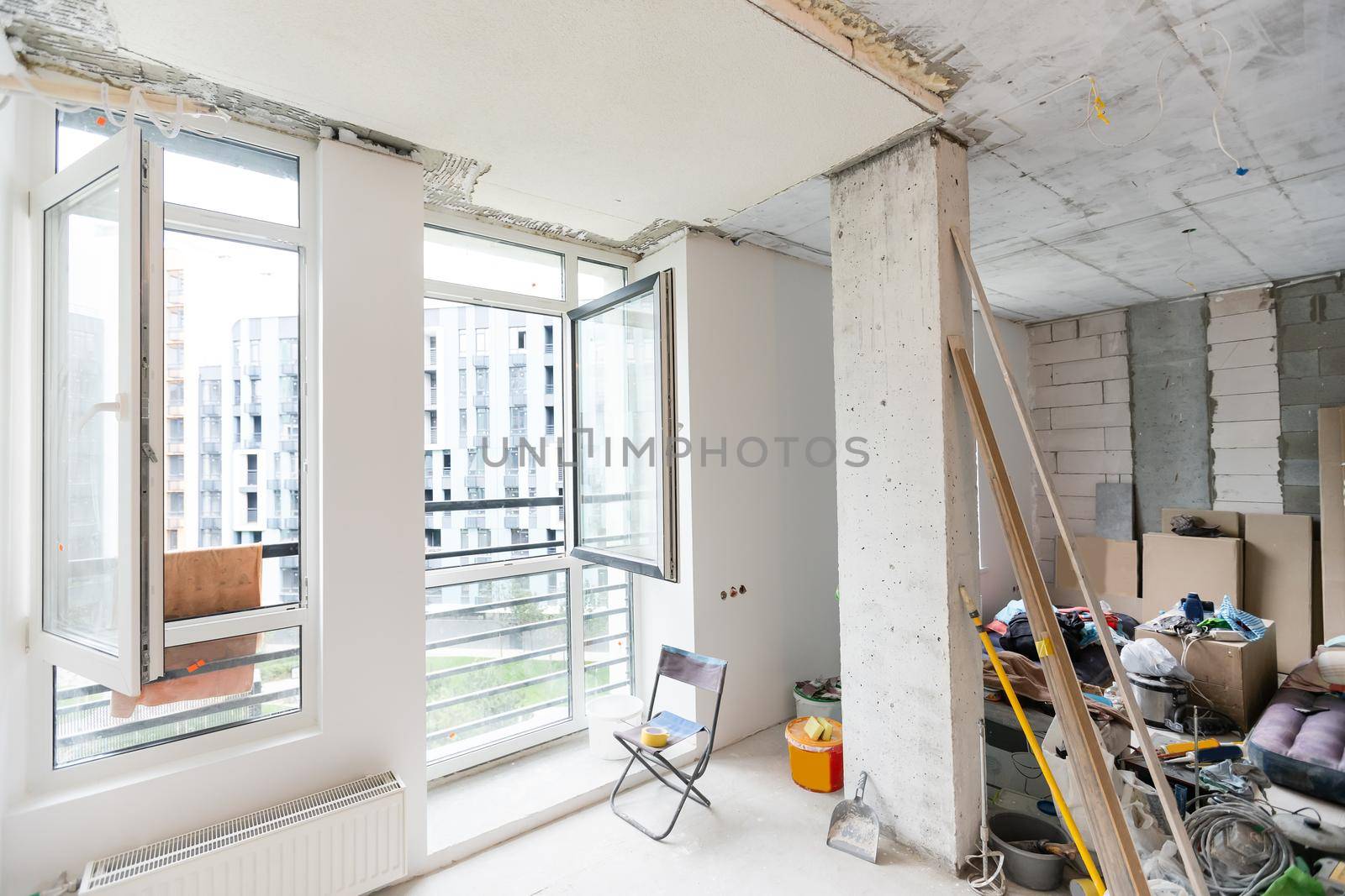 Interior of apartment with materials during on the renovation and construction, remodel wall from gypsum plasterboard or drywall