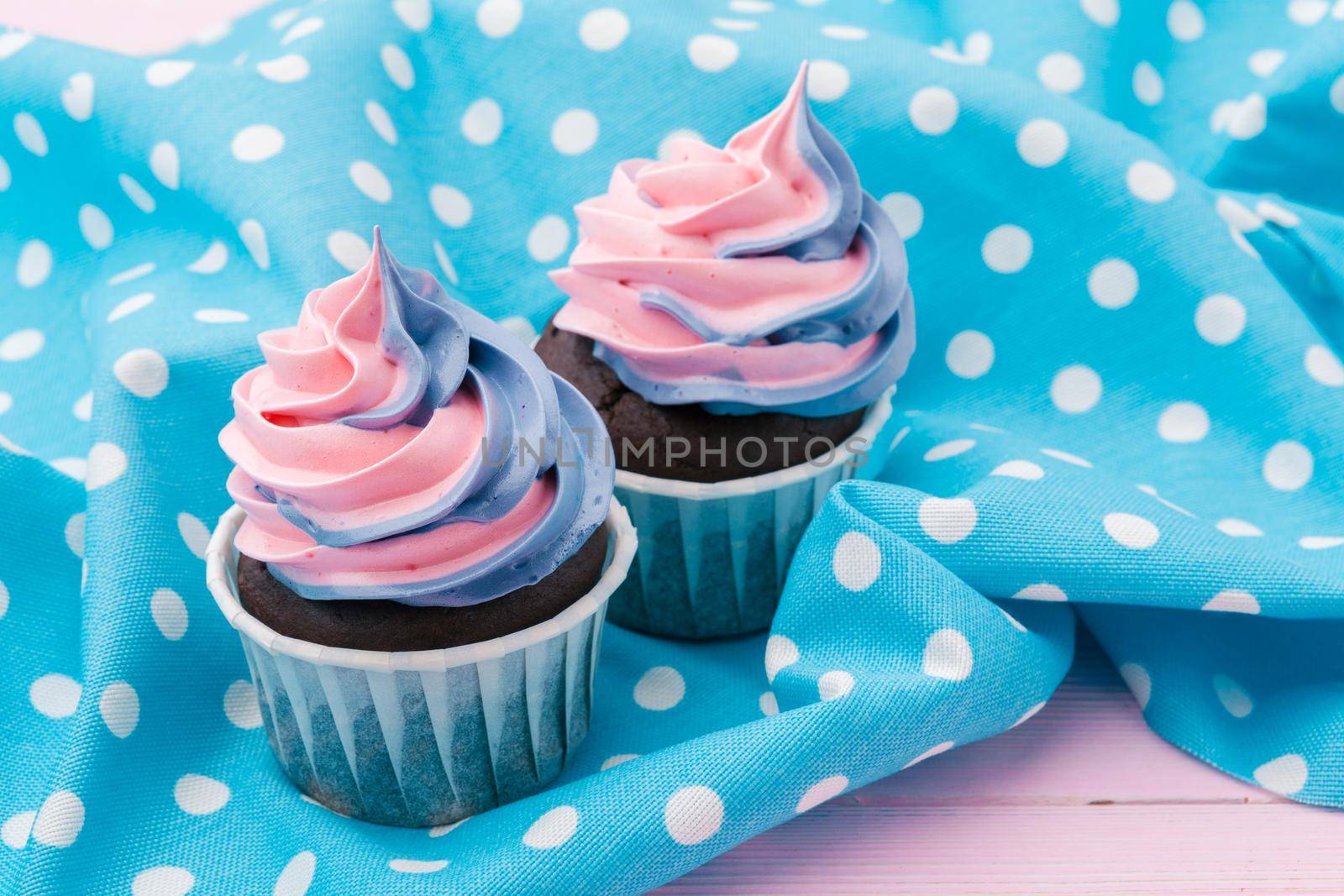 Side view of yummy cupcakes with assorted flavor. Shot on the table
