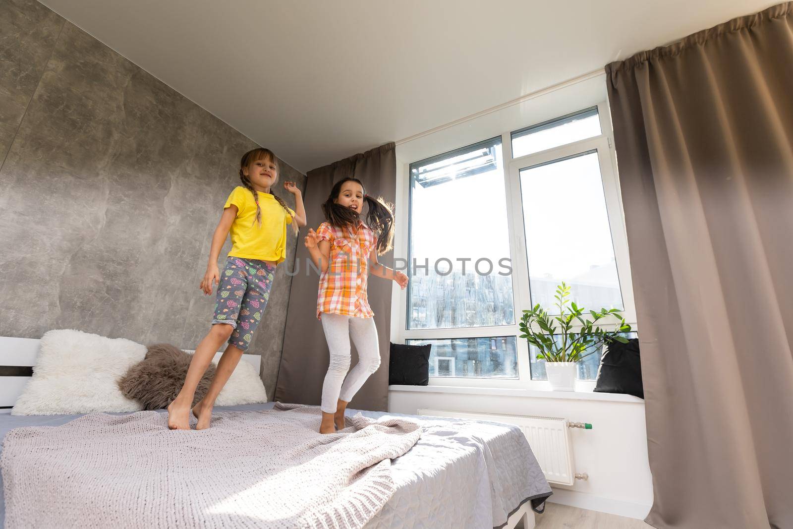 Creative cute girls, two sisters at home