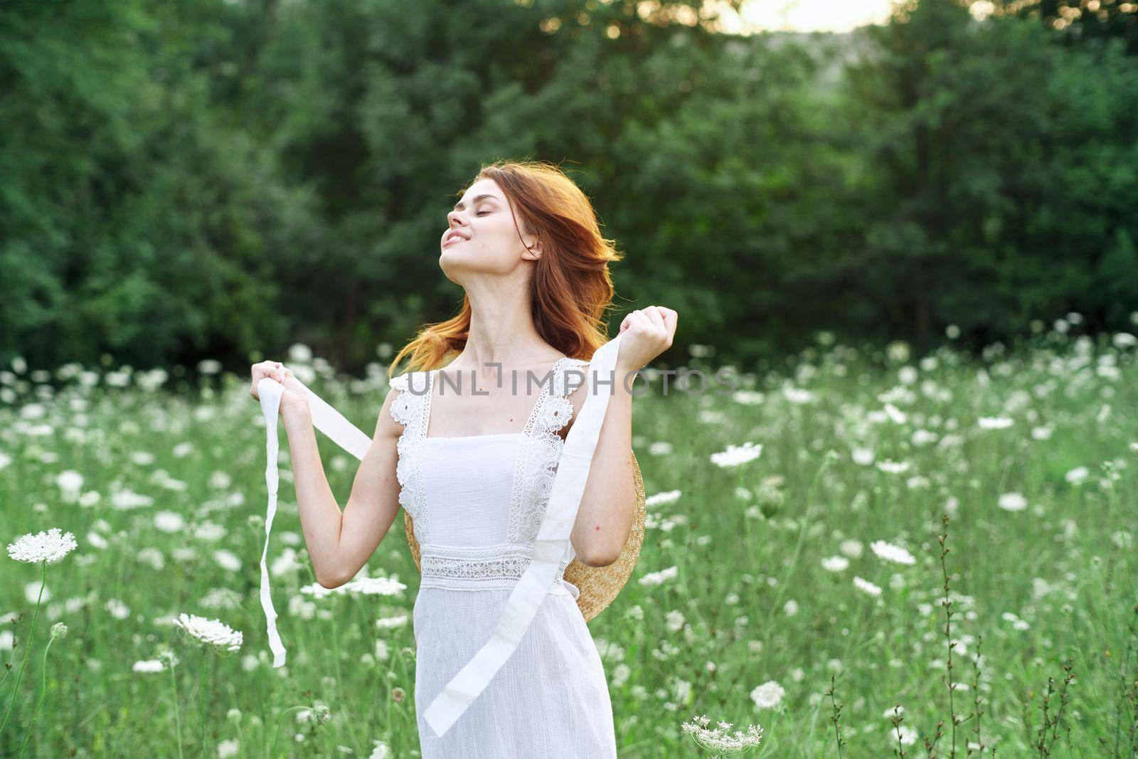 Woman in white dress flowers nature walk charm. High quality photo