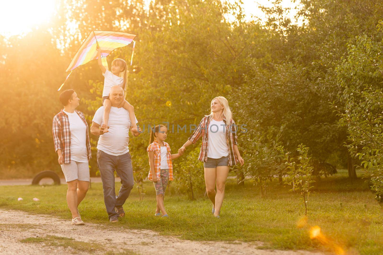 Multi Generation Family On Countryside Walk
