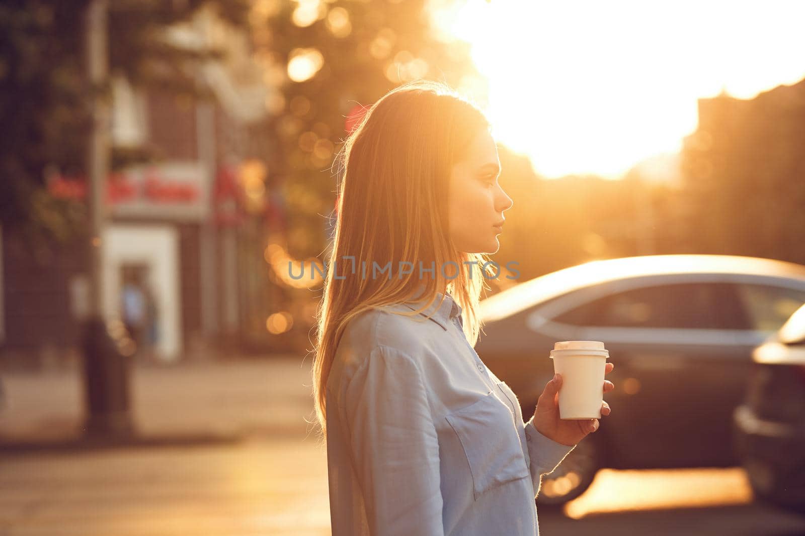 Business woman in a cafe in the summer outdoors on vacation. High quality photo